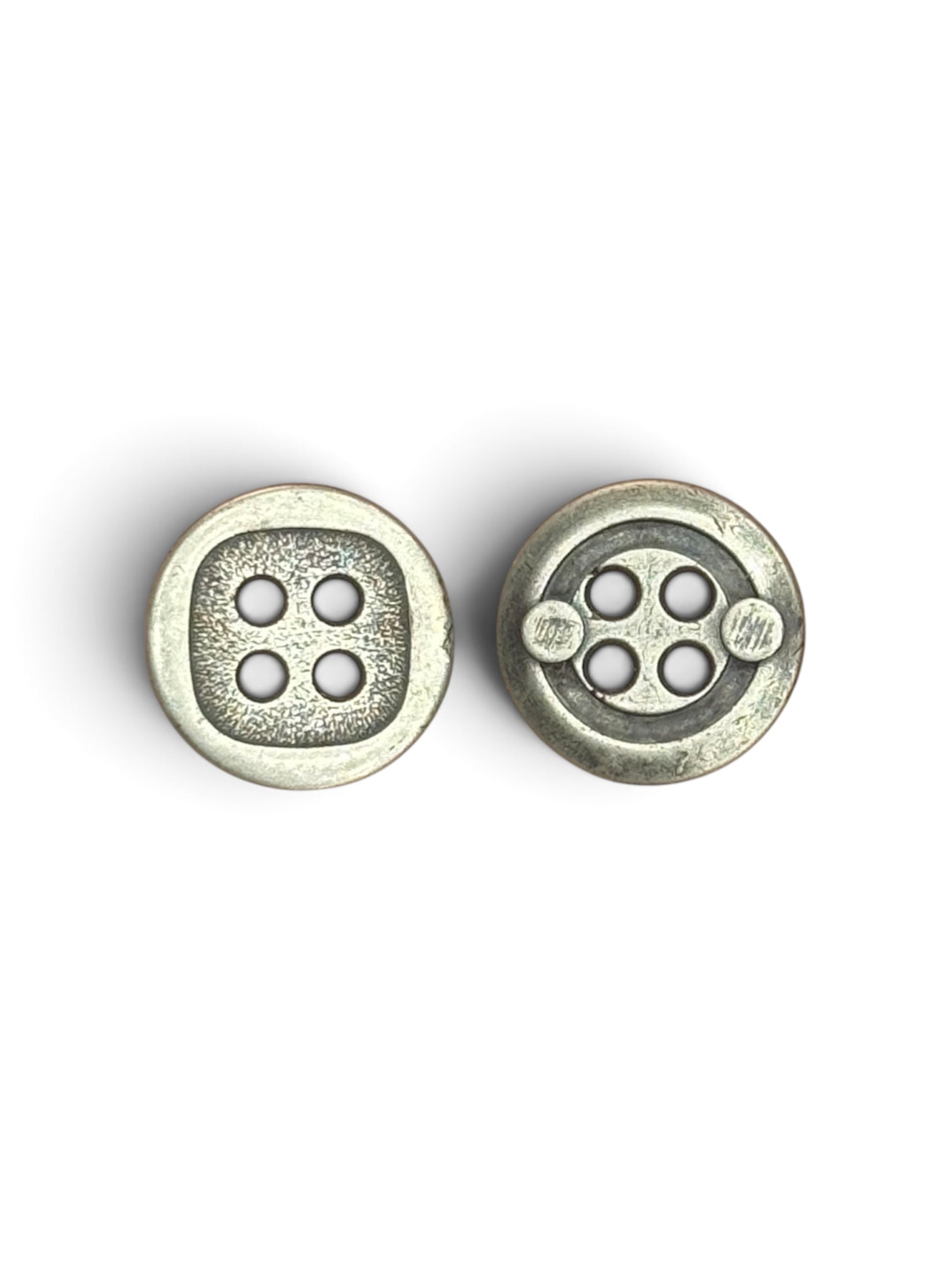 Two 15mm silver metal 4-hole buttons with unique round-square and geometric patterned designs.