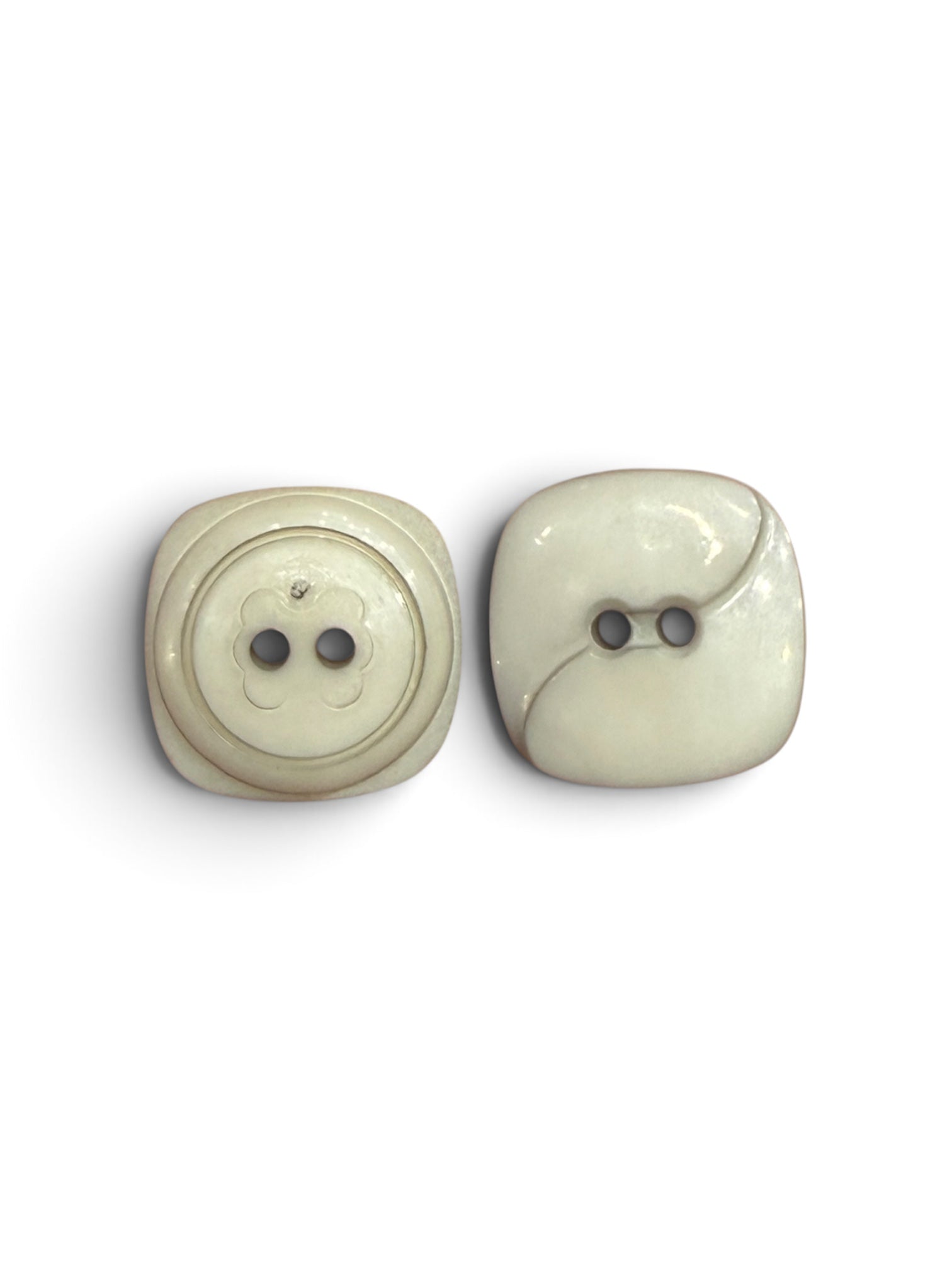Two 16mm grey square resin buttons with 2-hole designs and decorative engraved patterns.