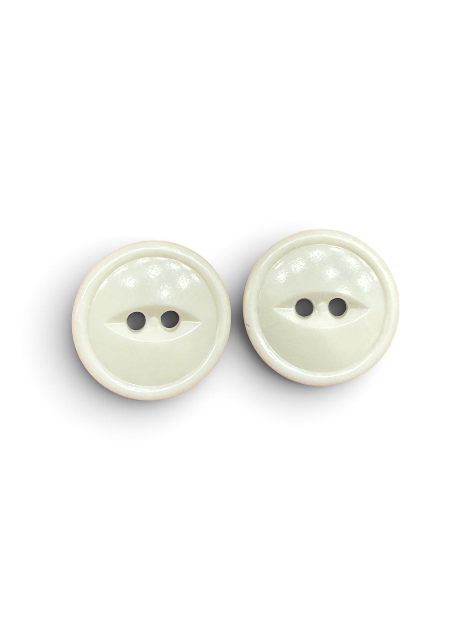 Two 18mm white resin 2-hole flat buttons for sewing on a white background.