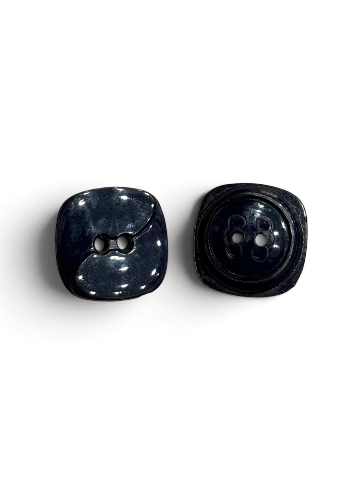 Two 16mm navy blue 2-hole resin sewing buttons with a glossy finish and square-rounded shape.