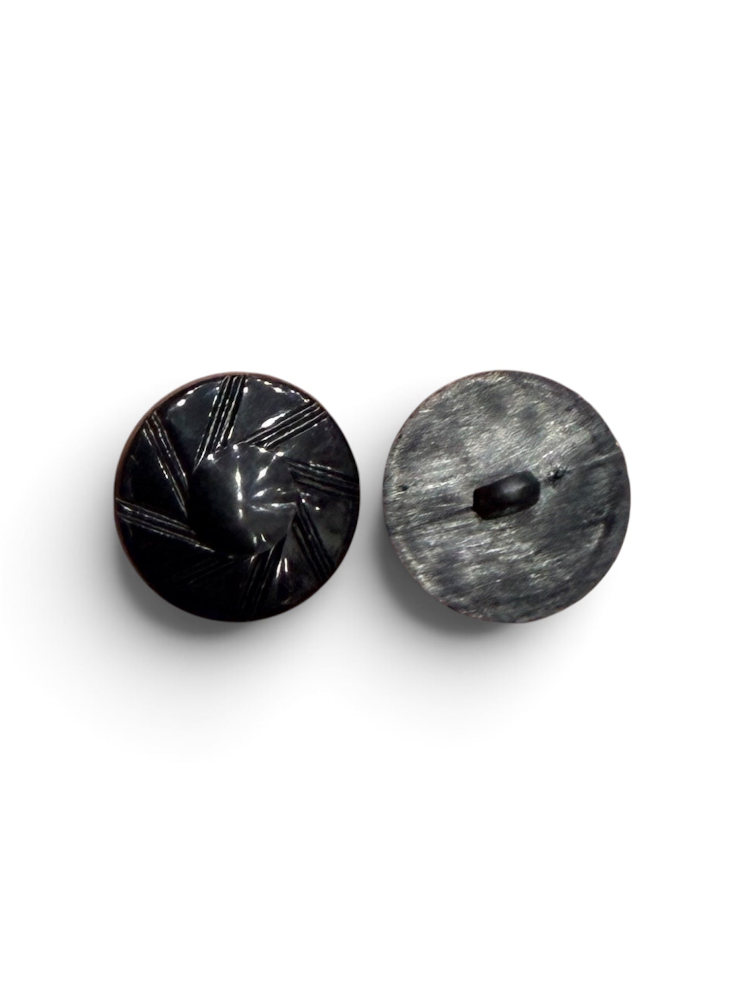 Front and back view of a 22mm black shiny resin circular designer sewing button with a shank back.
