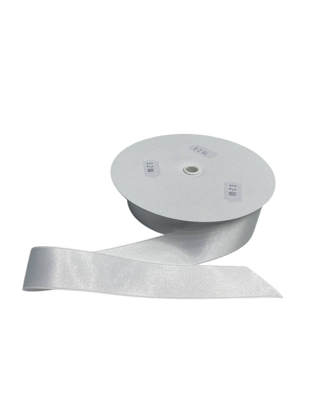 A roll of white double-faced satin ribbon with a cut end.