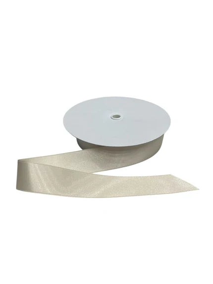 A spool of light beige double-faced satin ribbon with a subtle shimmer.