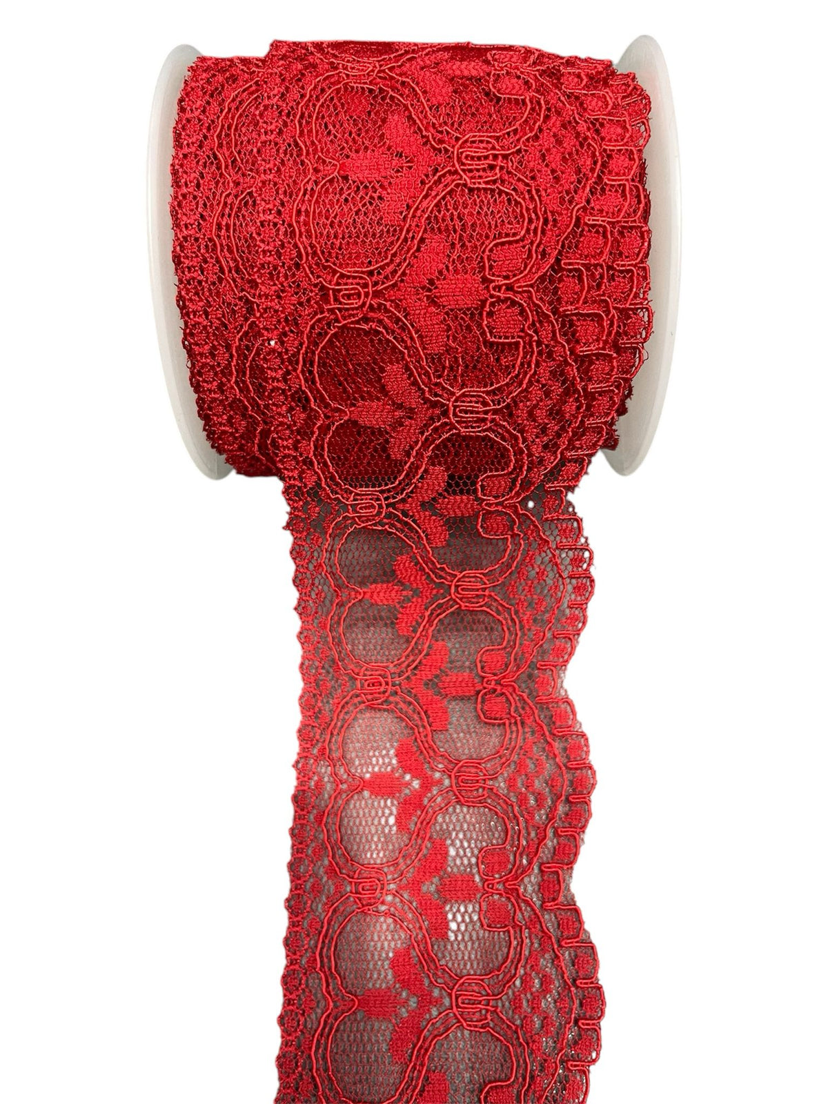 Red embroidered lace trim on a spool.