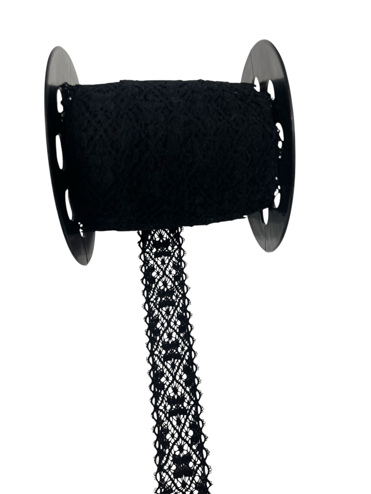 Black crochet lace ribbon on a spool.