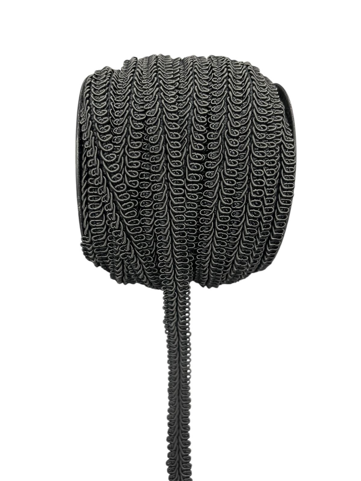 Rolled black decorative lace trim cord with a looped pattern.