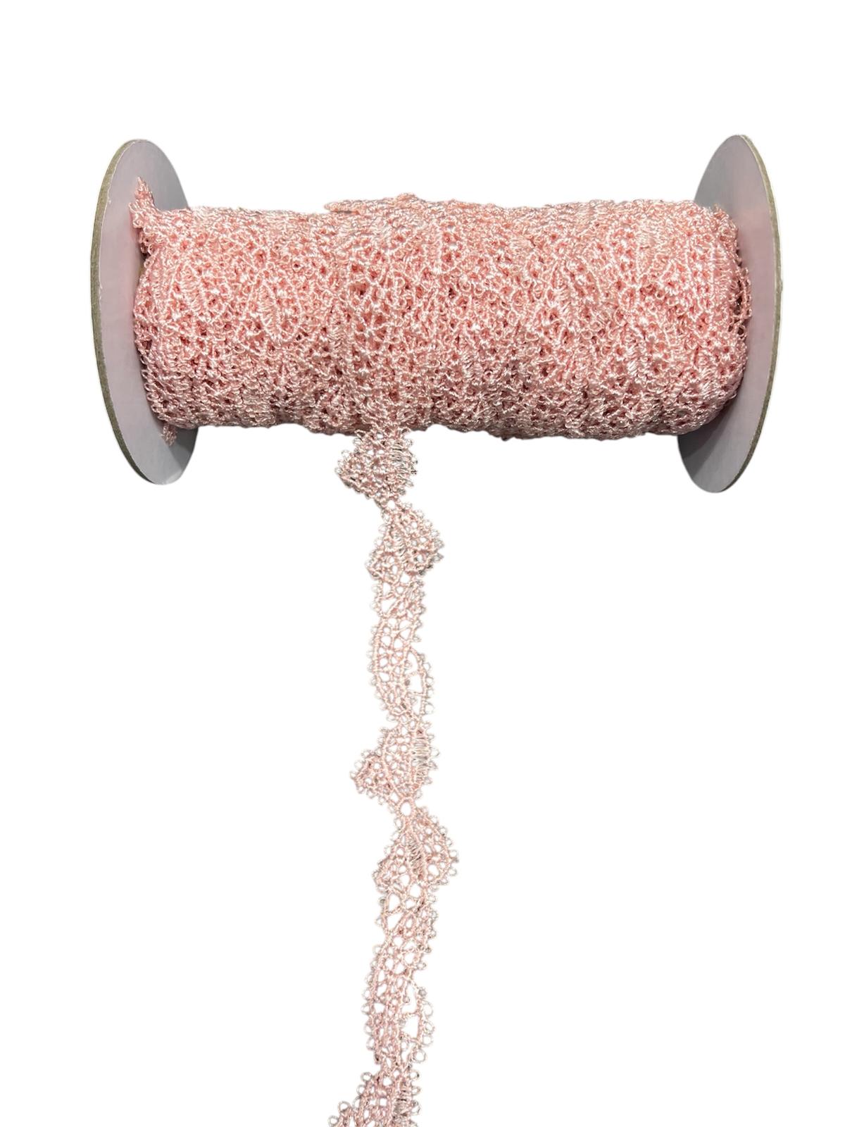 Rolled pink decorative lace trim cord with a wavy edge.