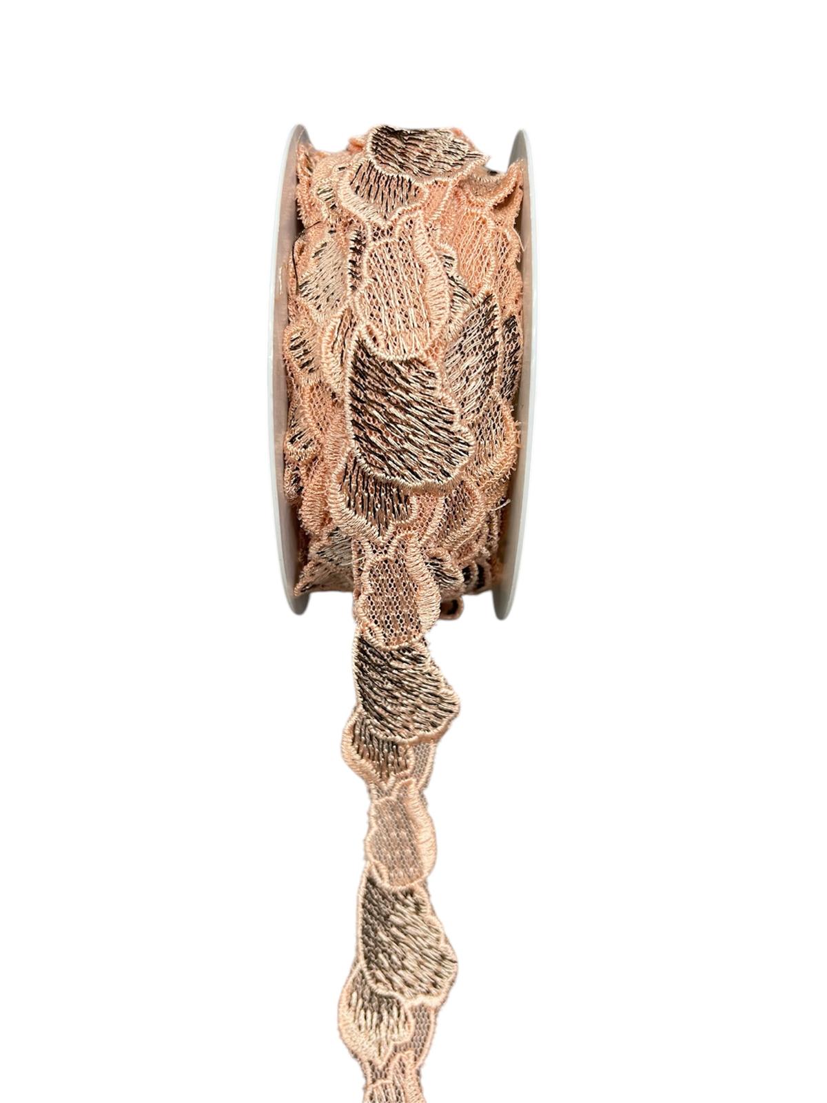 Decorative trim cord with a lace-like pattern in peach and gold.