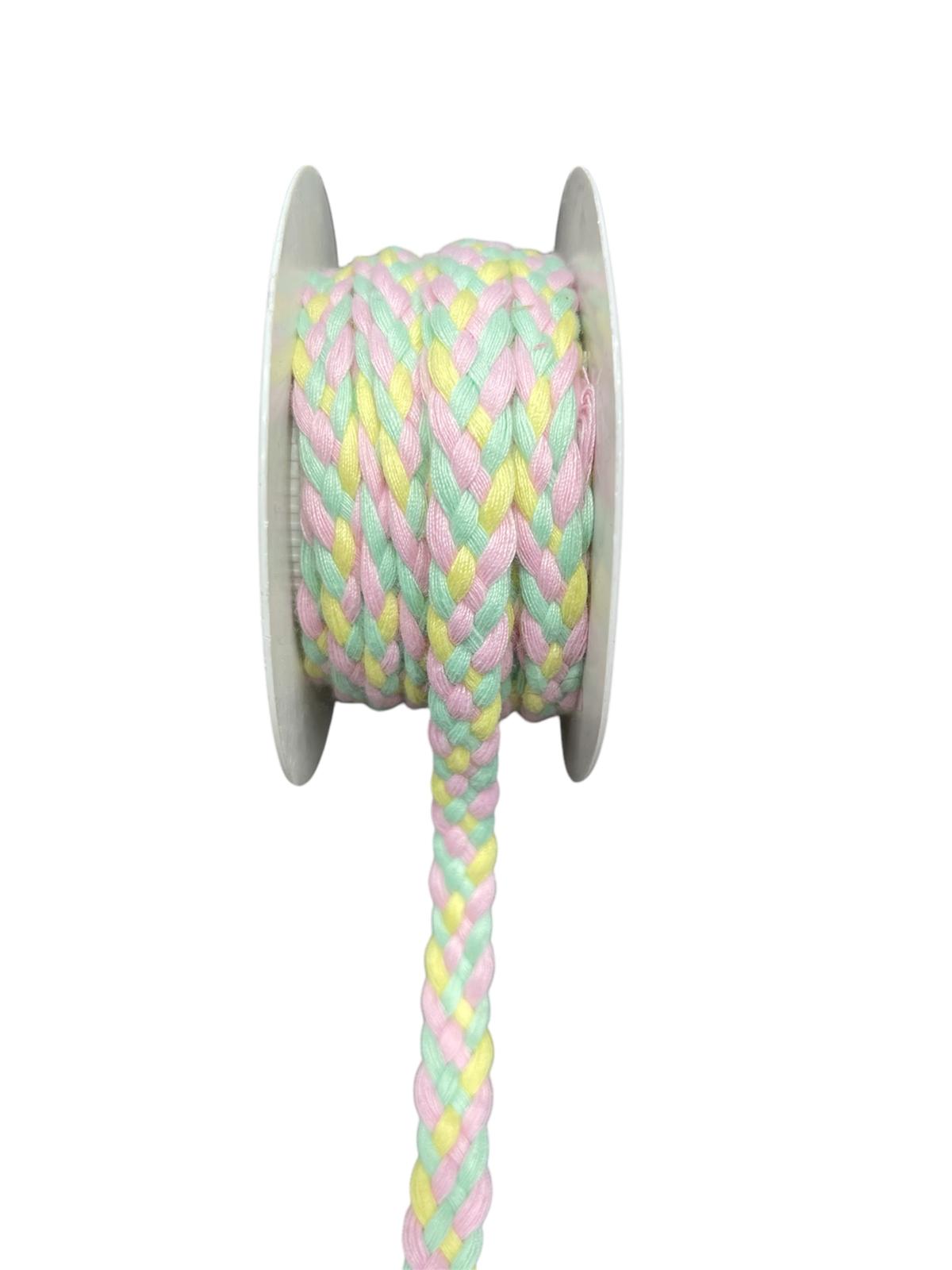 A spool of braided trim cord in pastel pink, yellow, and mint green.