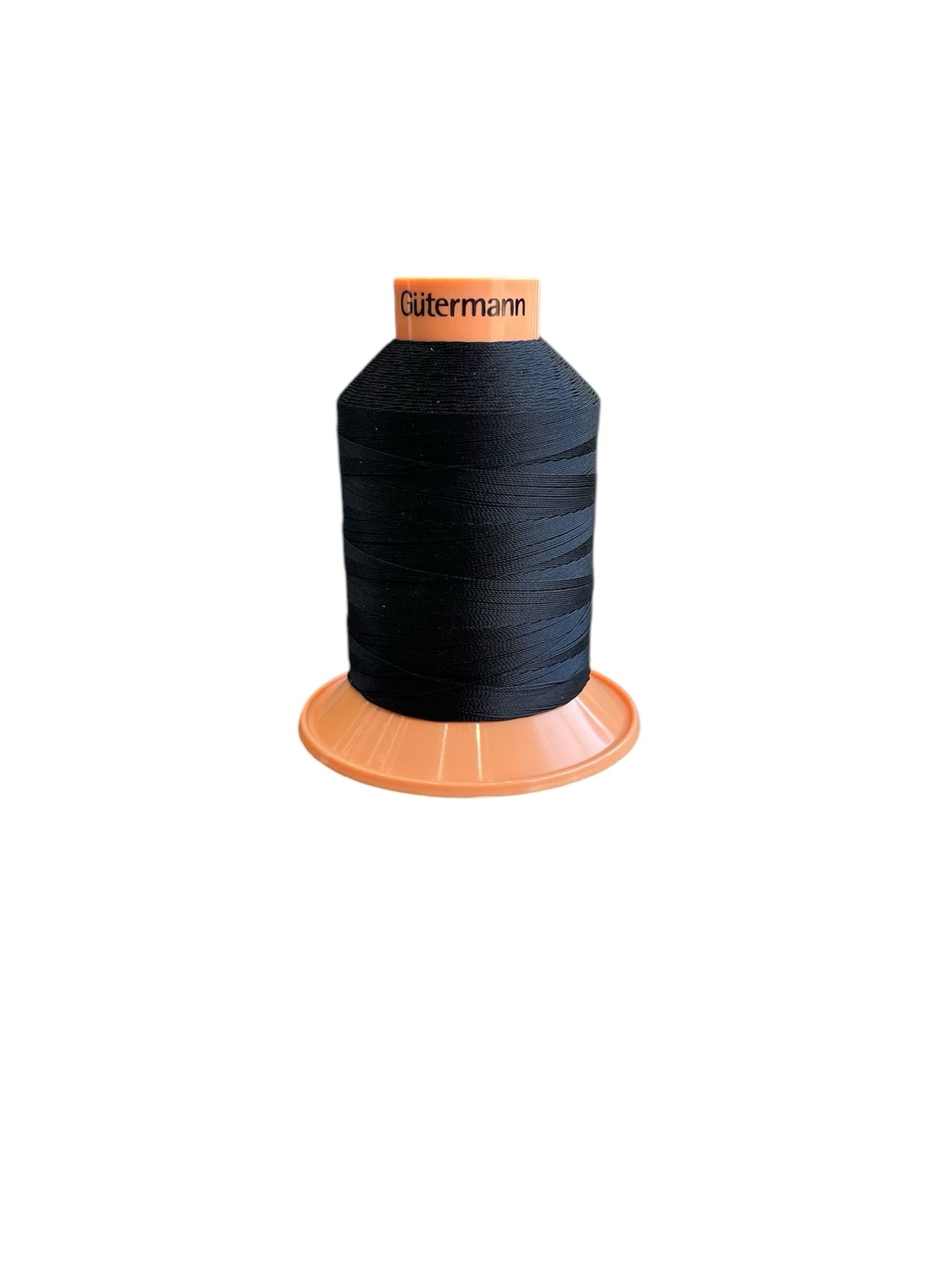 Gutermann Tera 30 black polyester thread on an orange spool.