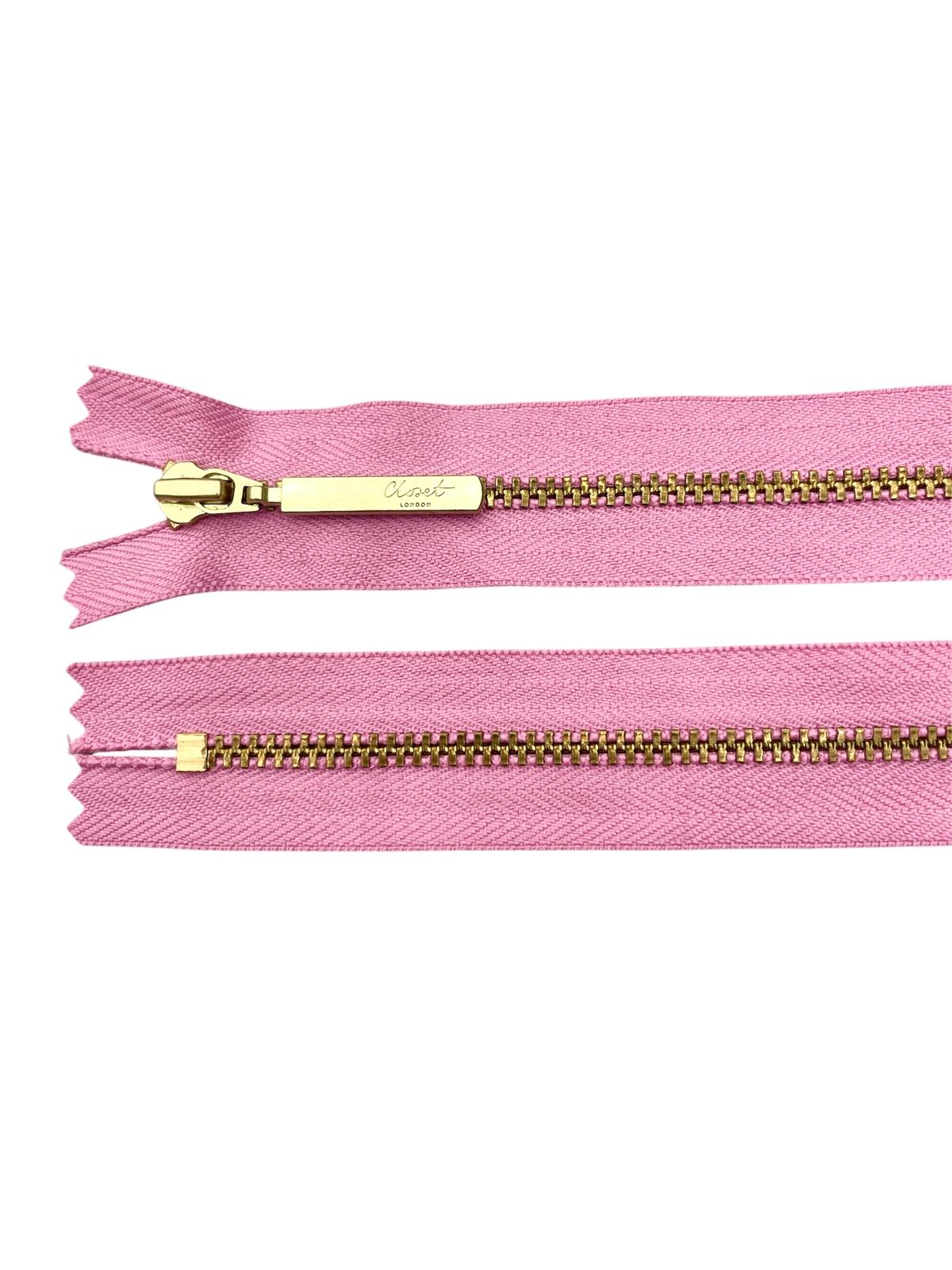 Pink YKK size 3 closed end gold metal zipper with "Closet London" branding.