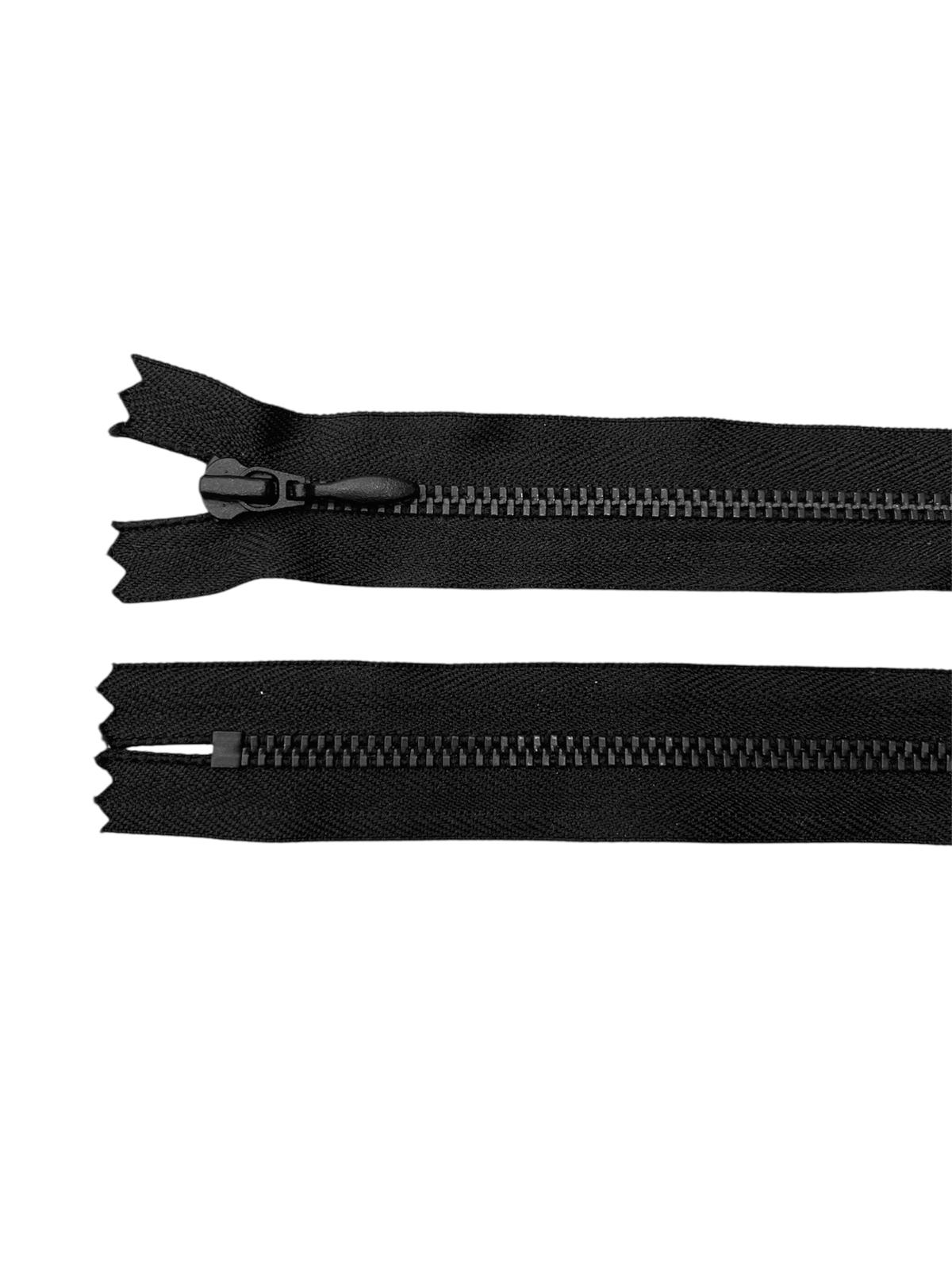 Two black YKK zippers, one with a slider and one without.