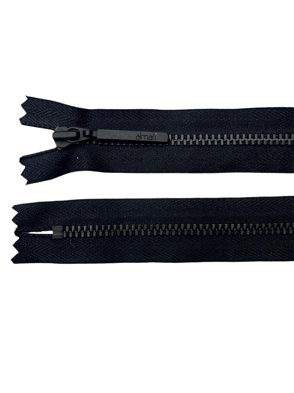 Black metal YKK zipper with a closed end and a branded slider.