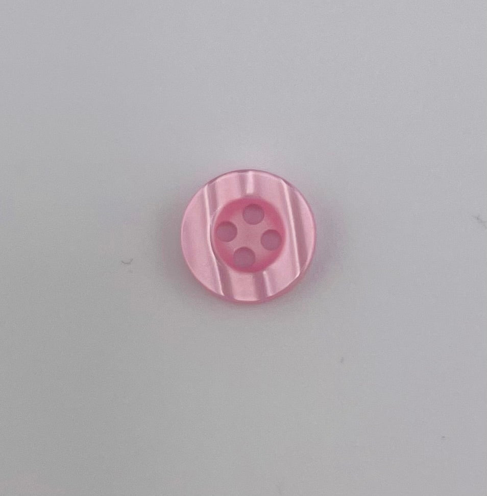 Galedi Pins pink polyester 4-hole button with vertical ridges.