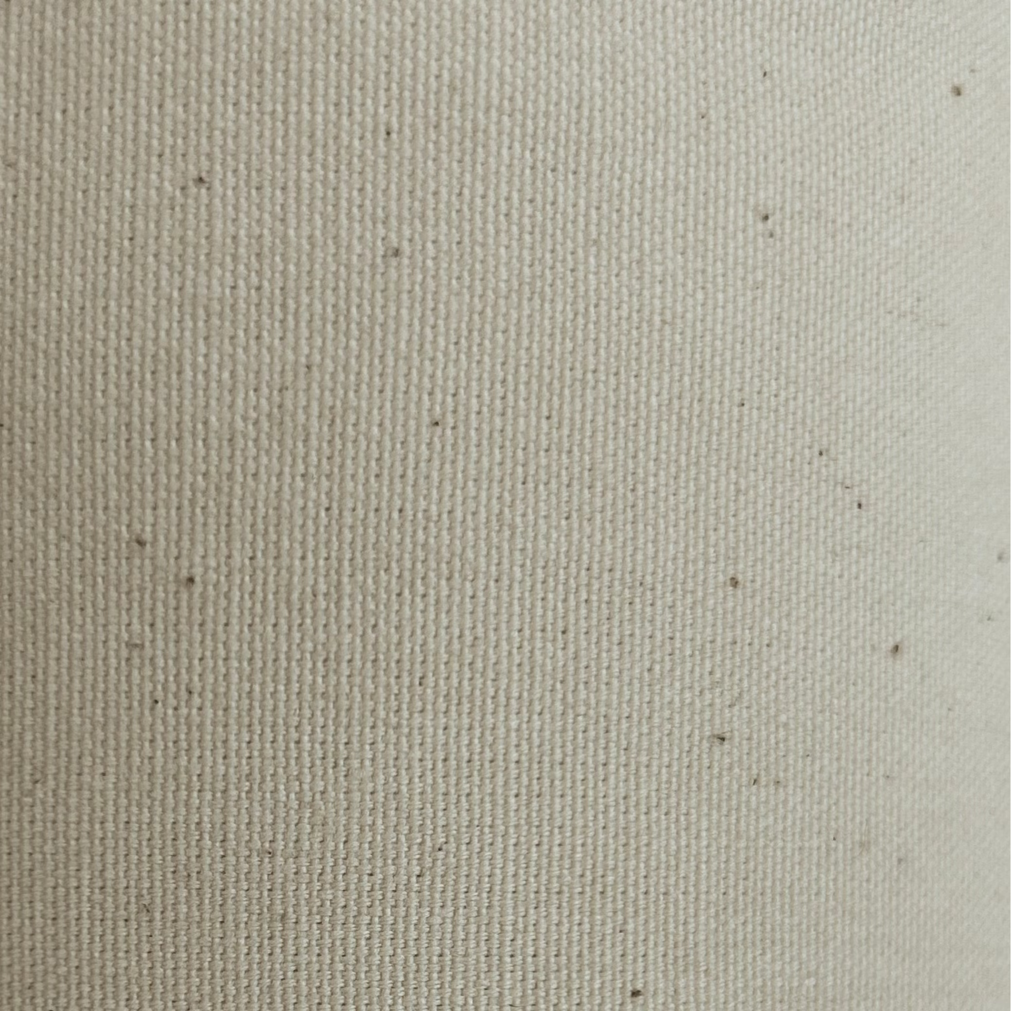 Natural colored heavy cotton calico fabric with a visible weave.