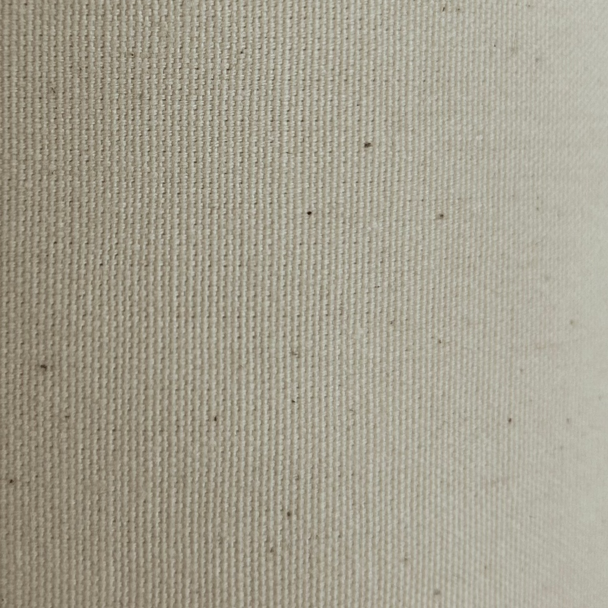Natural cotton calico fabric with a visible weave.