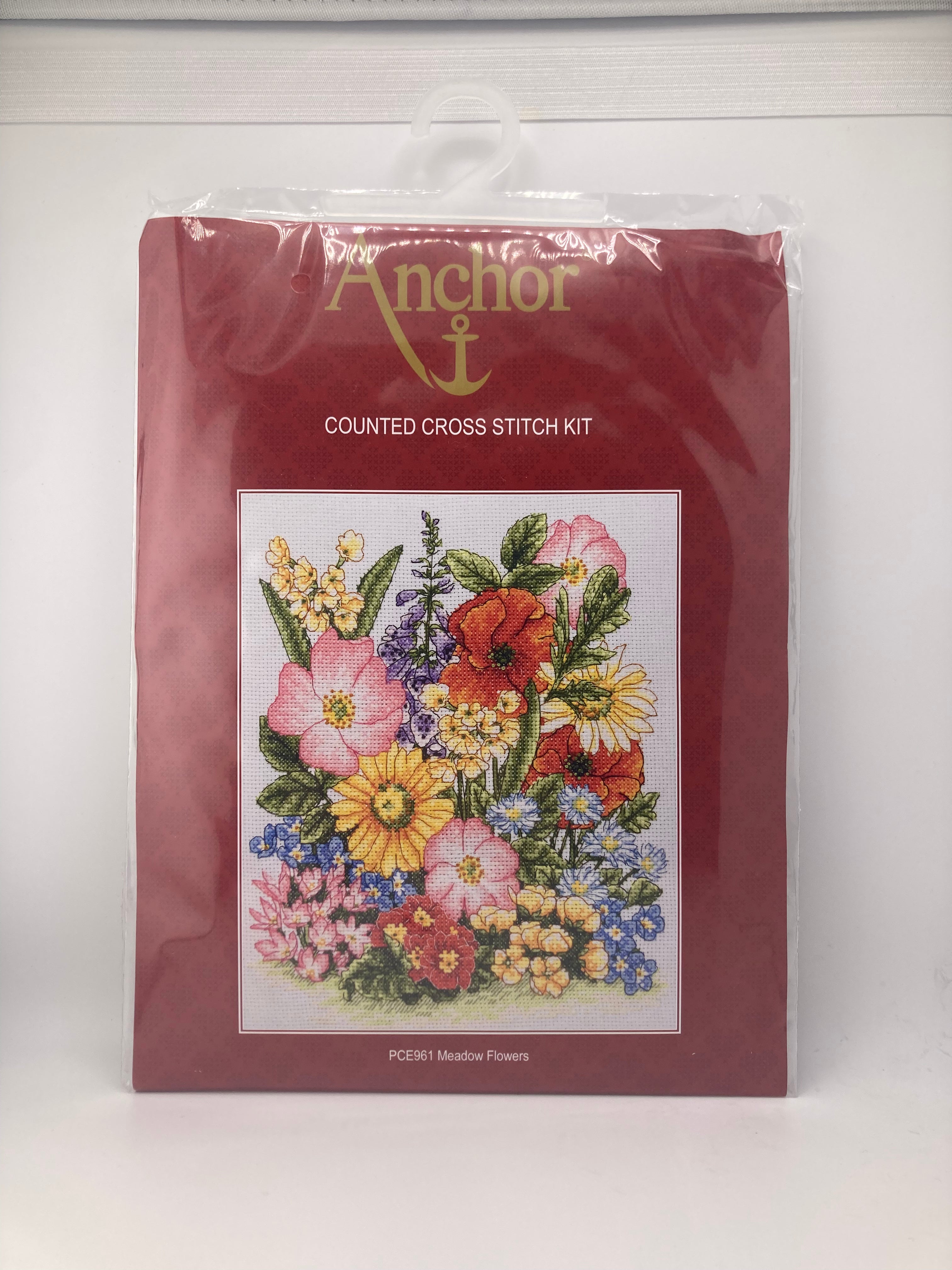 Anchor counted cross stitch kit featuring a colorful meadow flowers embroidery.