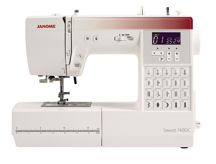 White Janome 740DC computerized sewing machine with digital display and stitch selection.