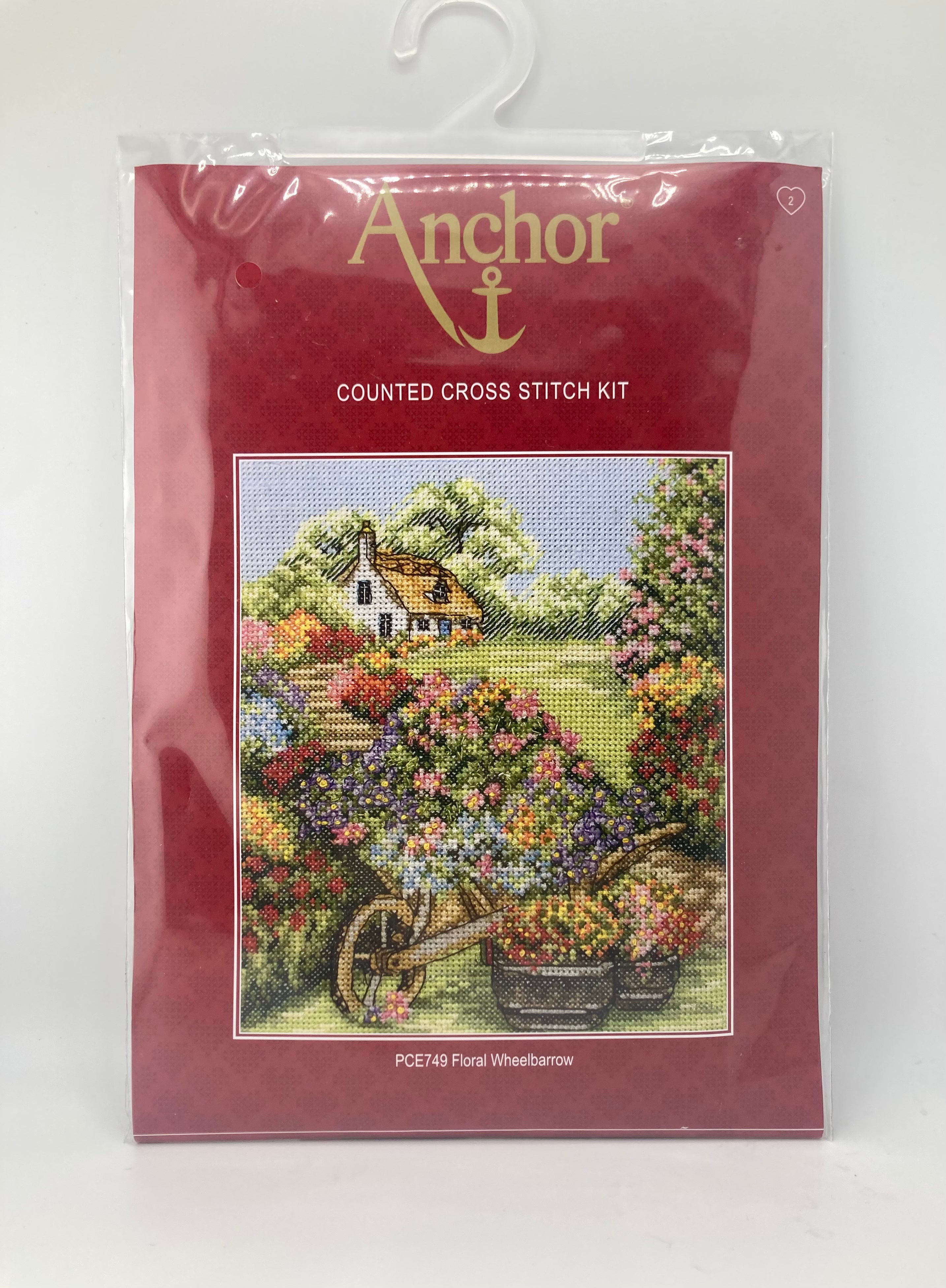 Anchor counted cross stitch kit featuring a floral wheelbarrow design.