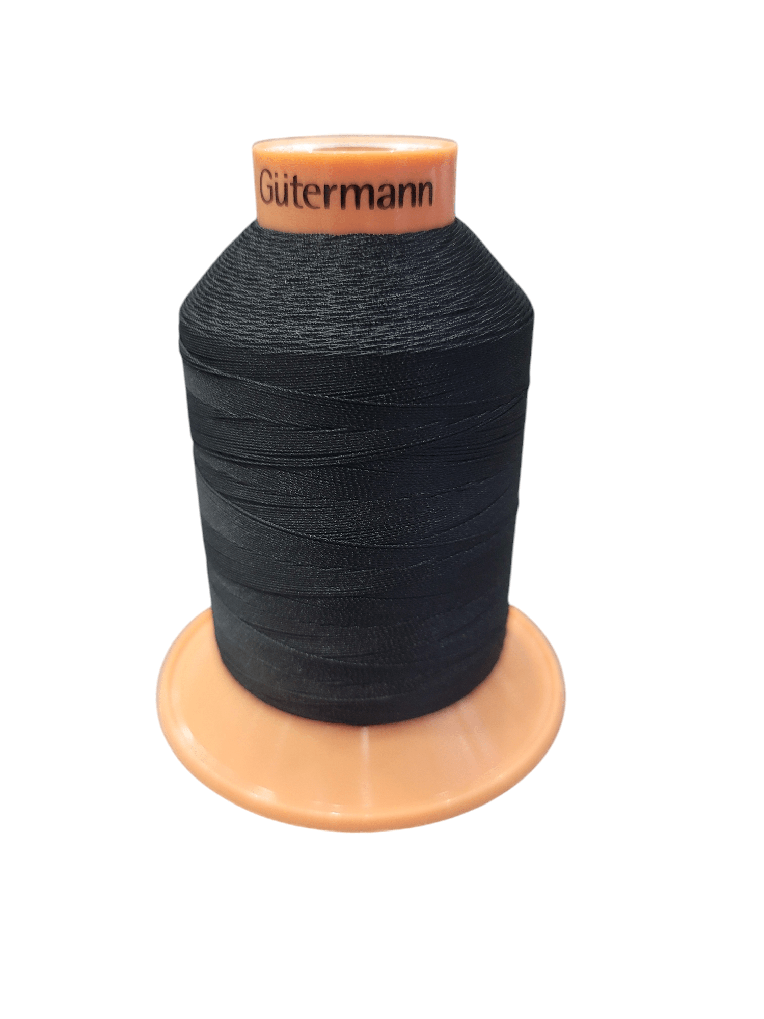 Gutermann Tera 30 black polyester thread on an orange spool.