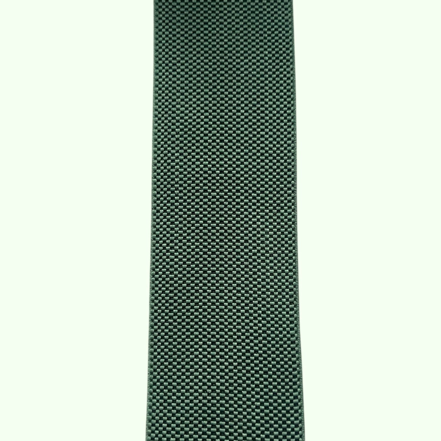 A strip of green woven elastic fabric with a textured pattern.