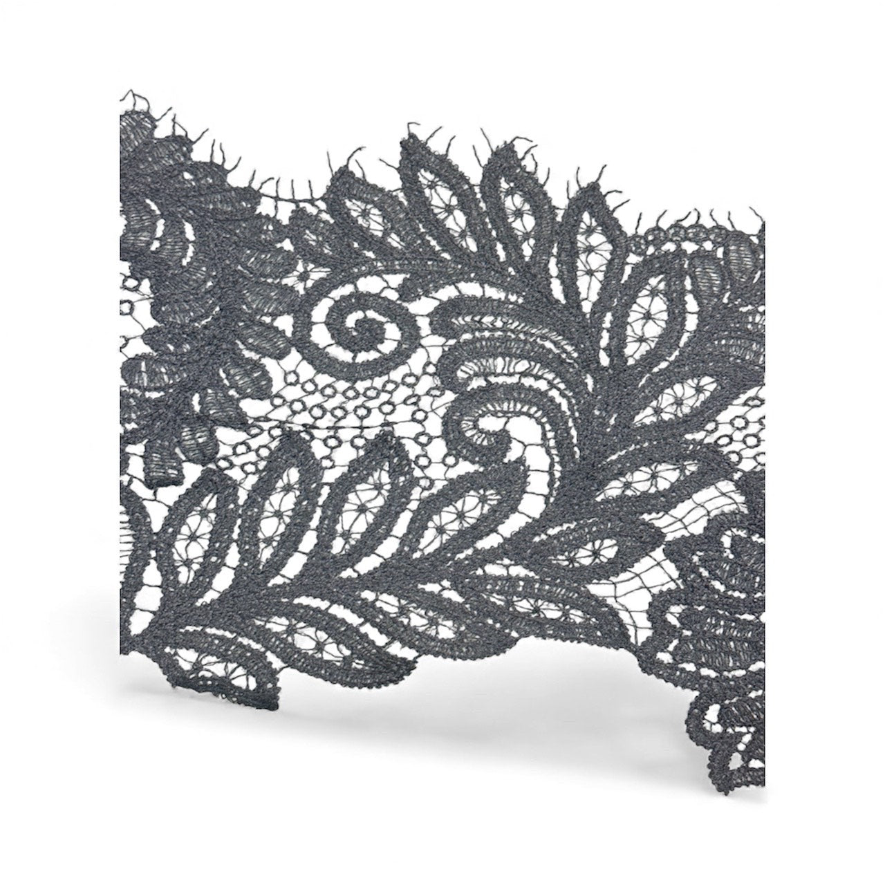 Black lace trim with intricate floral and scroll patterns.
