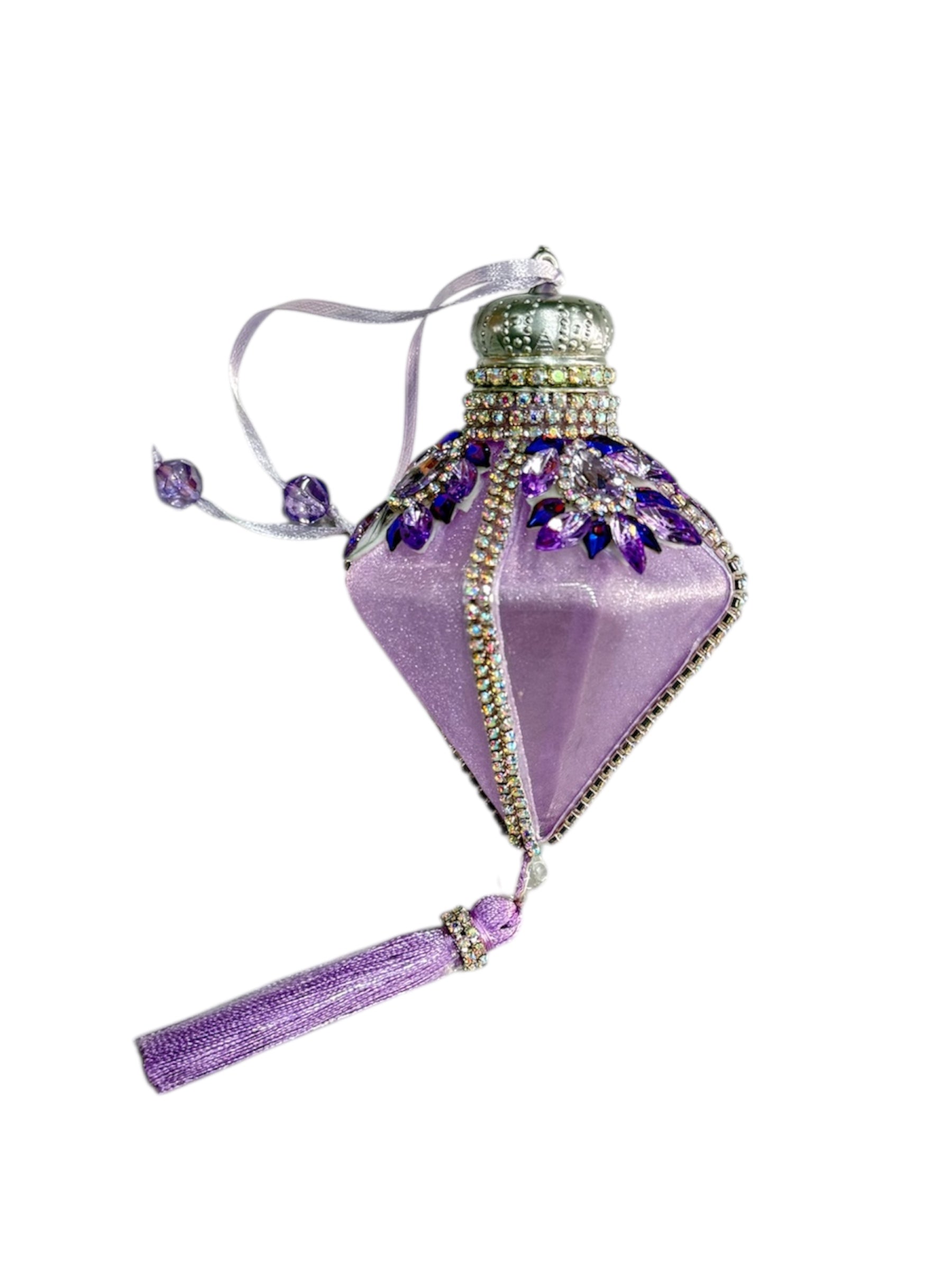 A purple diamond-shaped ornament with a silver crown, purple gems, and a tassel.