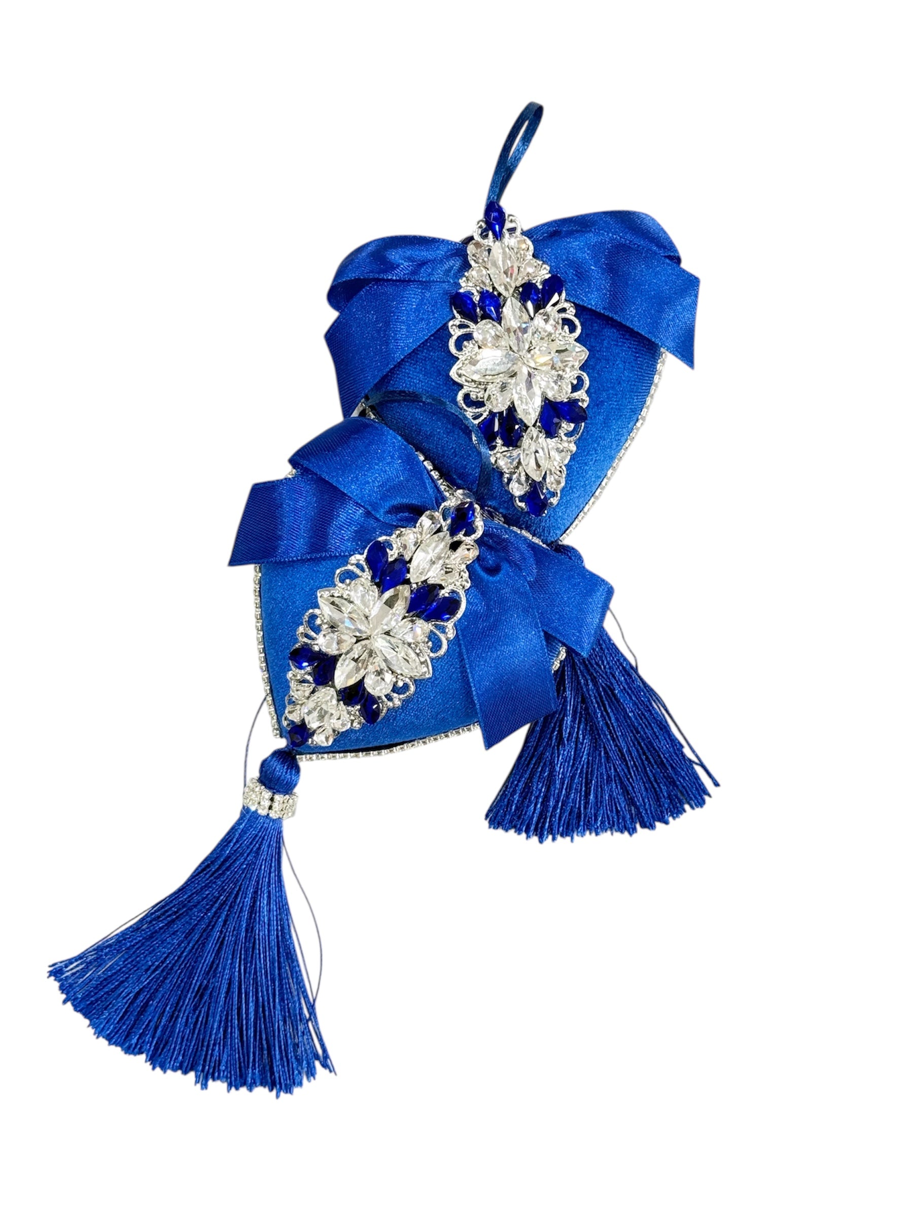 Dark blue heart-shaped Christmas ornaments with rhinestones and tassels.