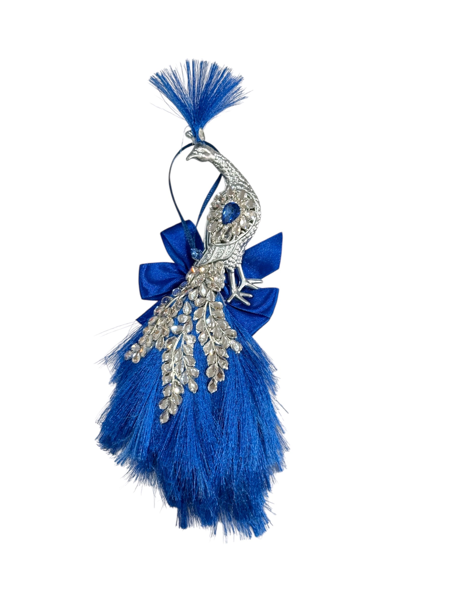 Dark blue peacock ornament with silver accents and blue fringe.