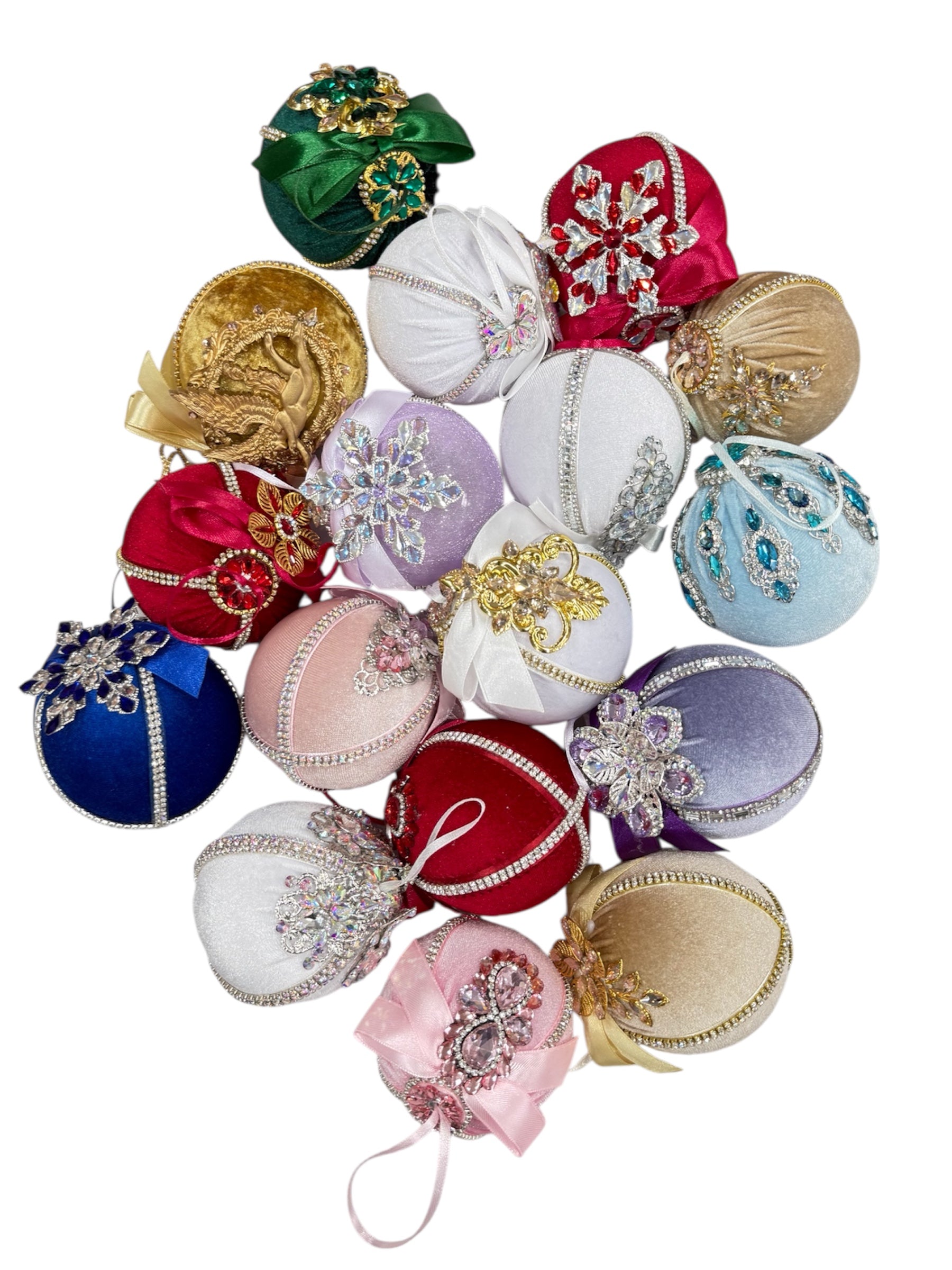 Hand-embroidered round Christmas ornaments in various colors with jewel and ribbon embellishments.