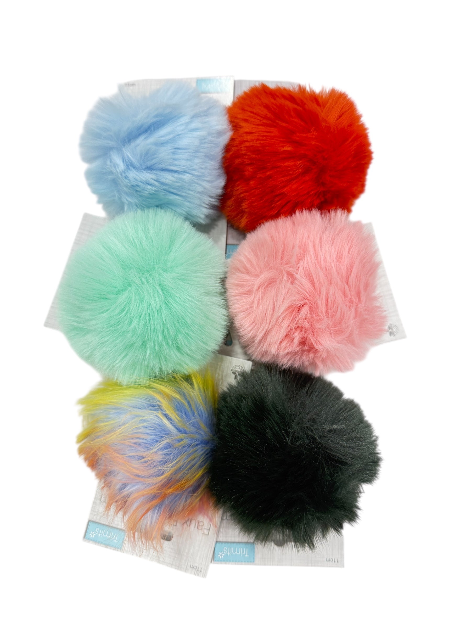 Six faux fur pompons in blue, red, mint, pink, multi-colored, and black.