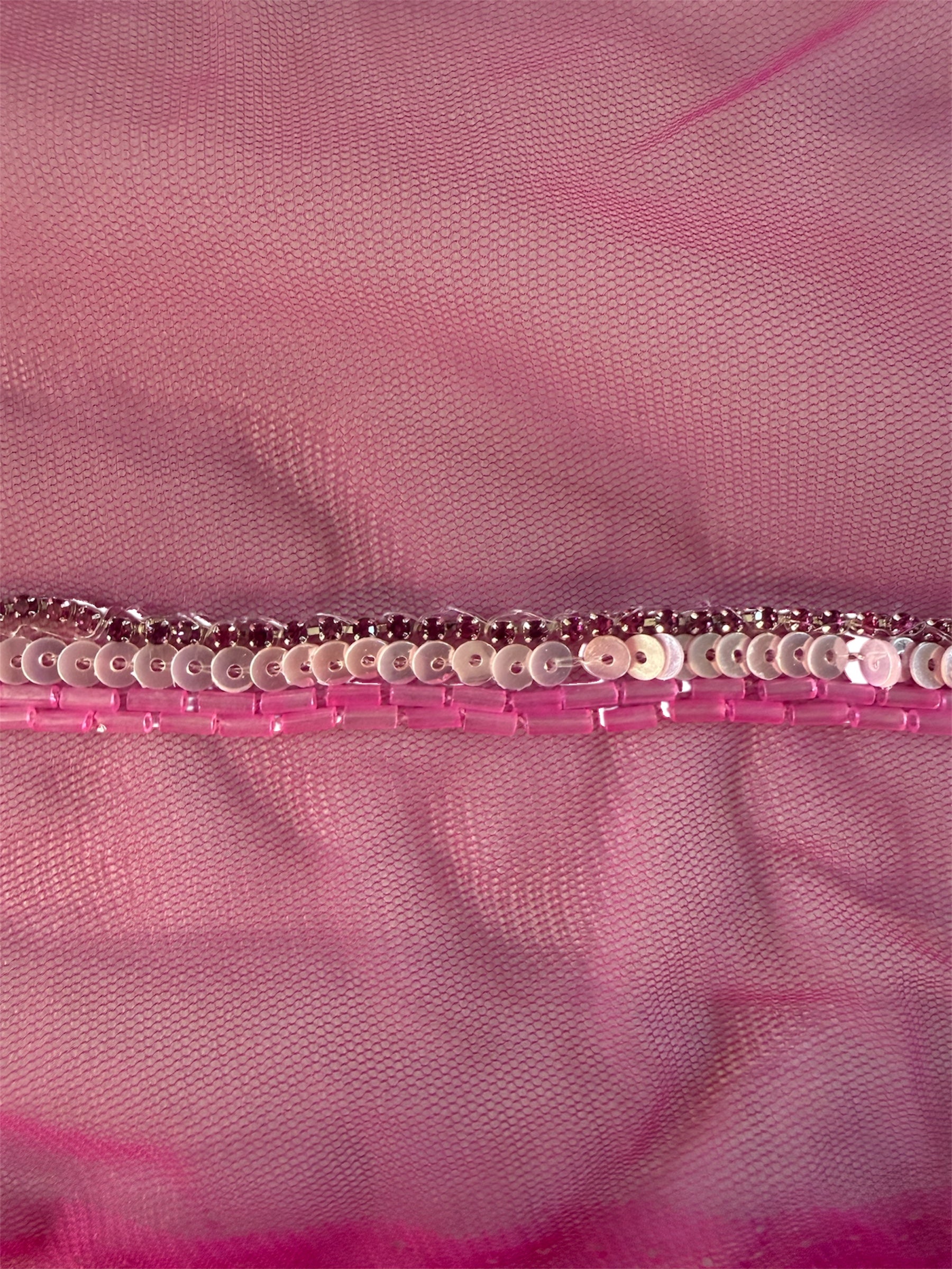 Pink netted trim with sequins and beads.