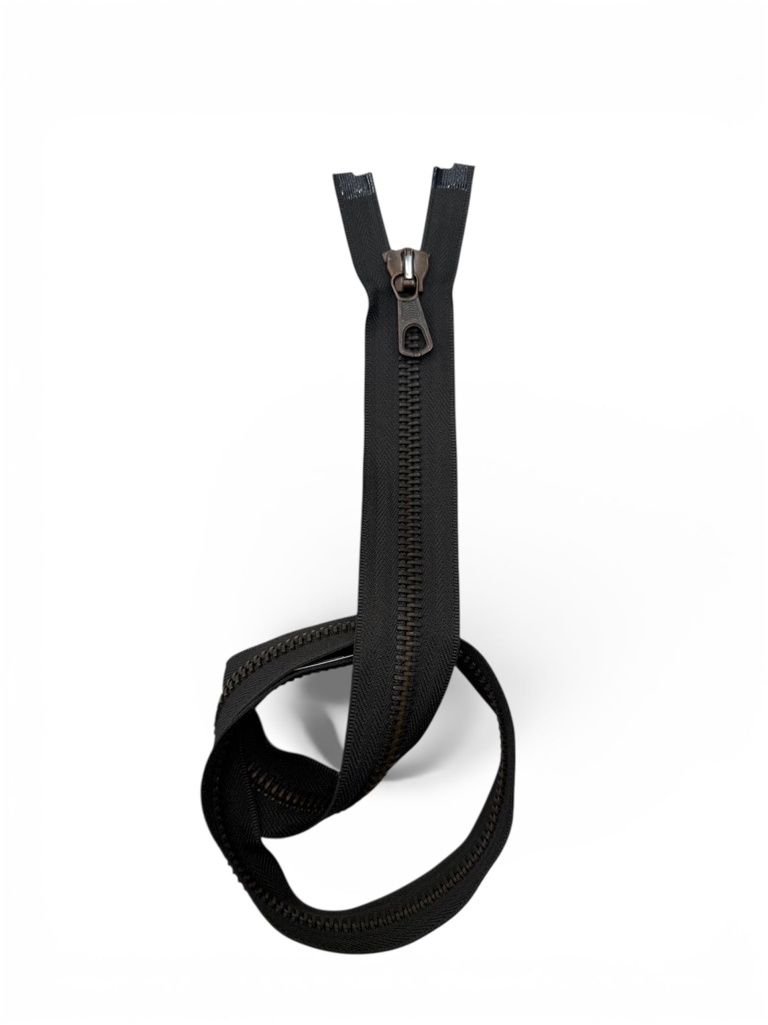 A black, heavy-duty, open-end zipper with a brass slider is shown.
