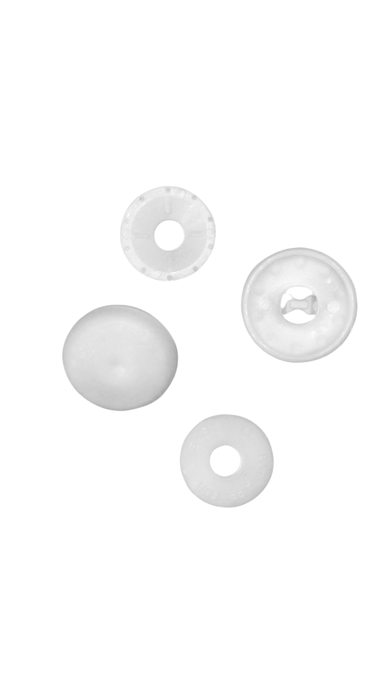 Four white plastic cover button blanks in different sizes and views on a white background.