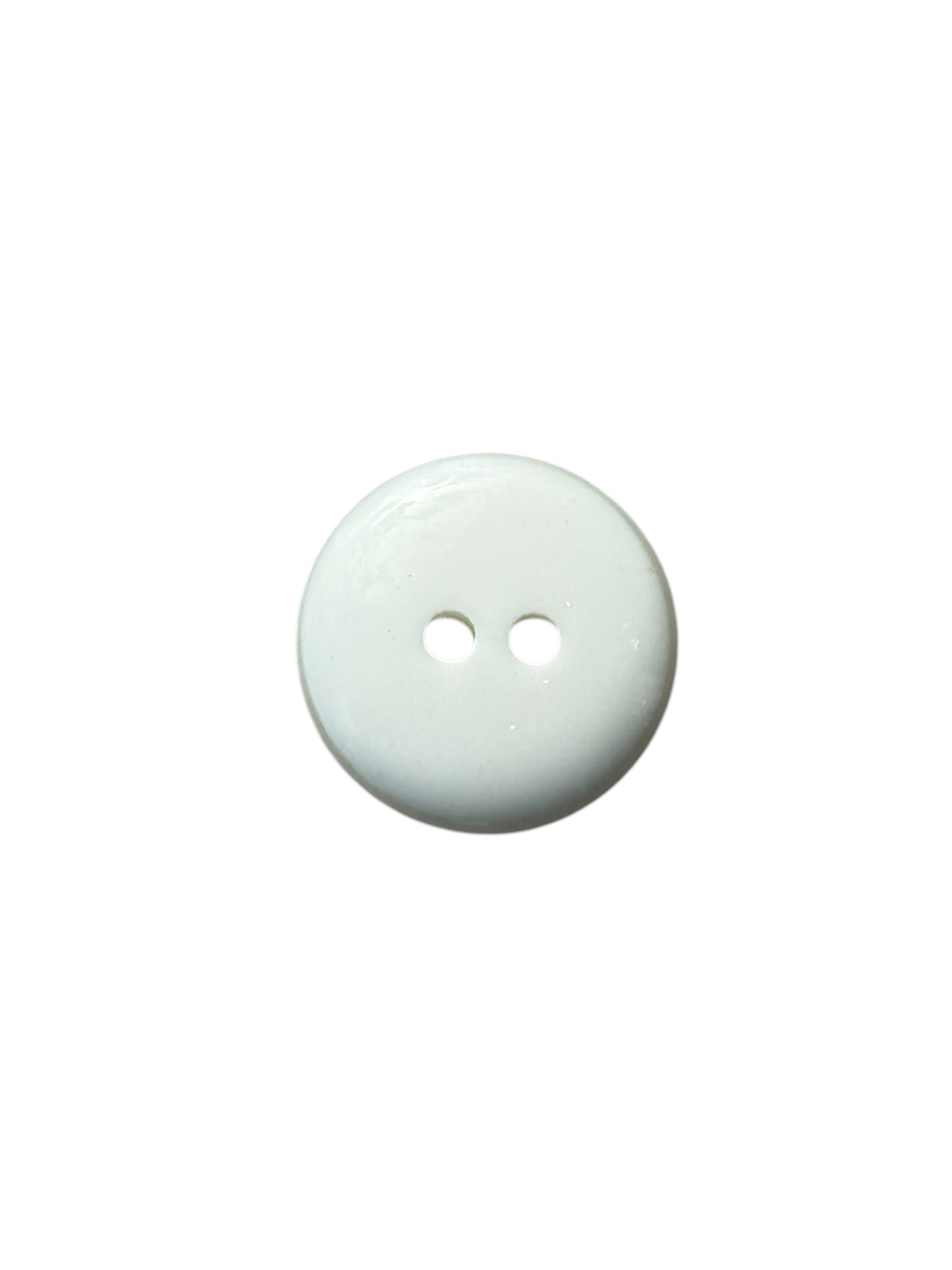 A single round, two-hole plastic button with a shiny ivory finish on a white background.