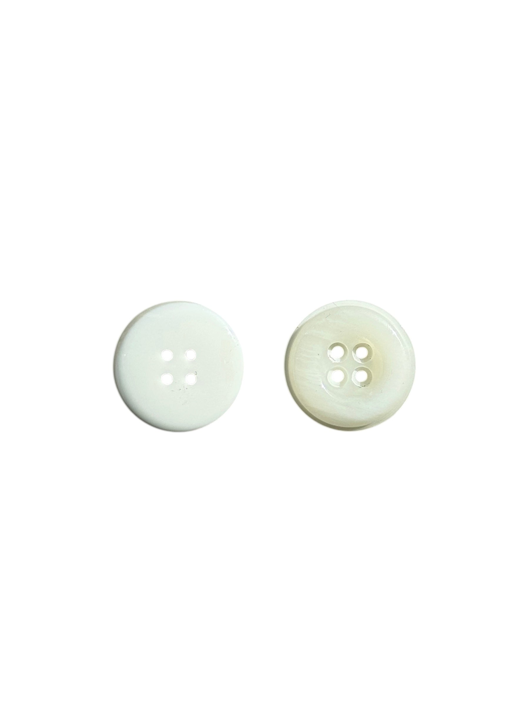 Two white, four-hole sewing buttons with a double round profile shown against a white background.