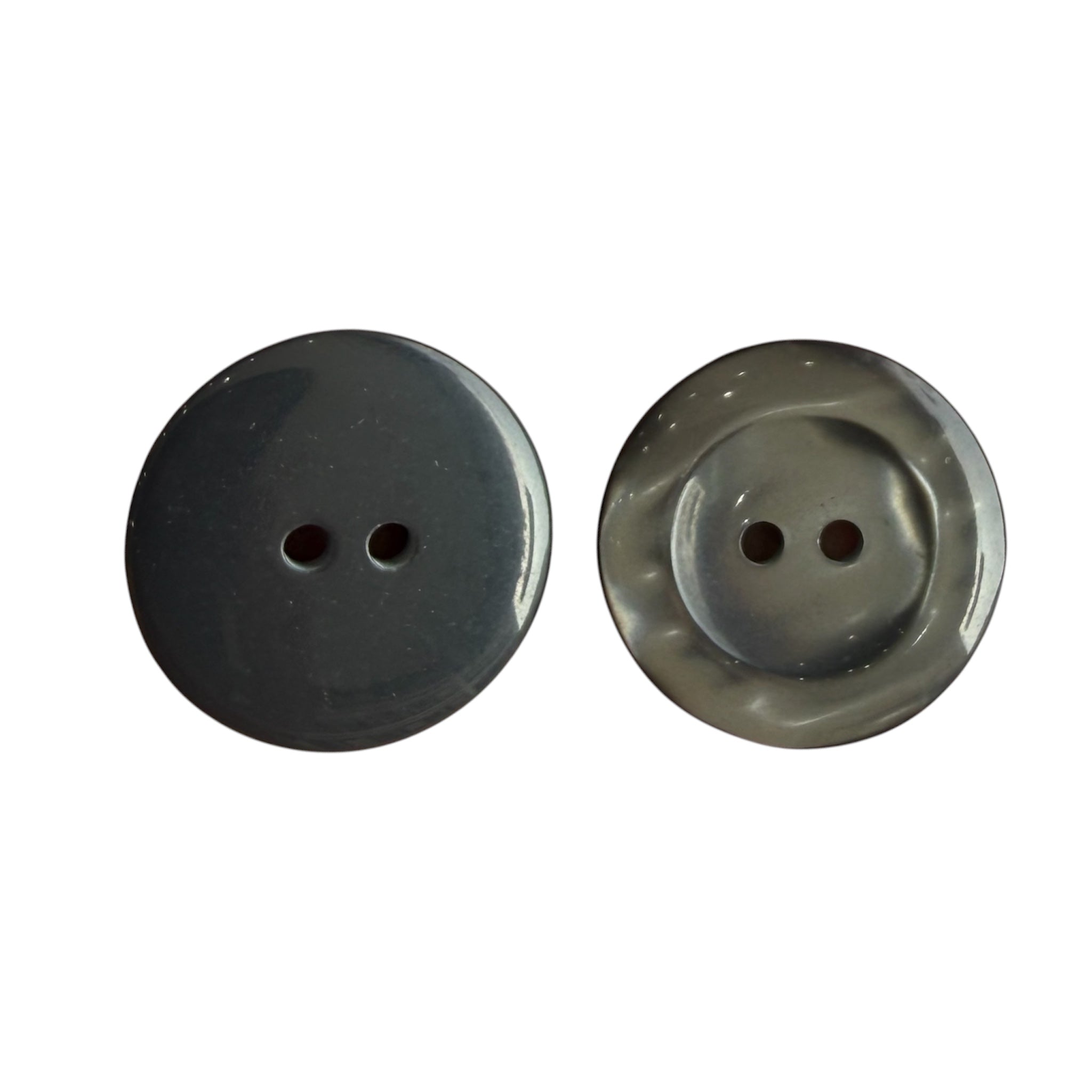 Two round grey buttons with two holes, one showing a smooth side and one showing a textured side.