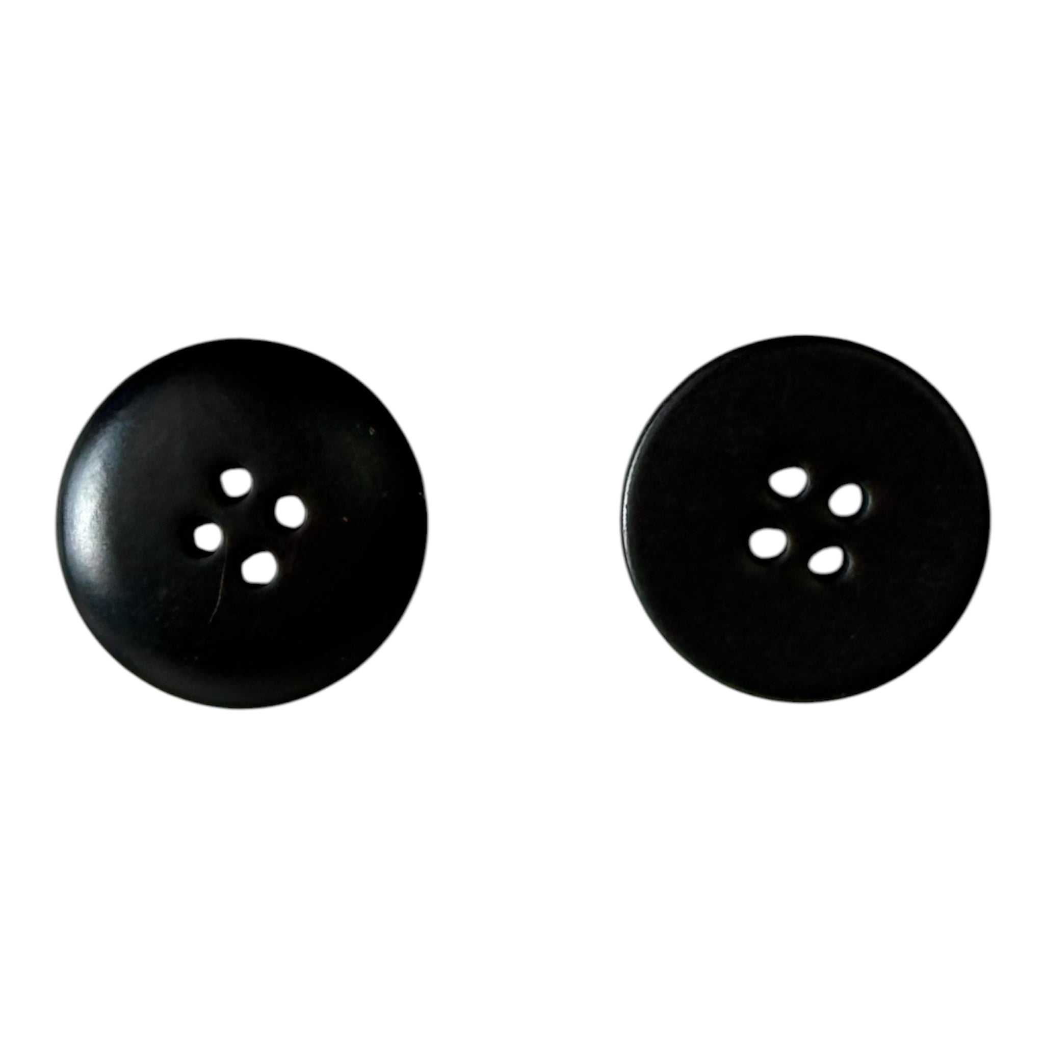 Two 18mm plain black buttons with four holes on a white background.