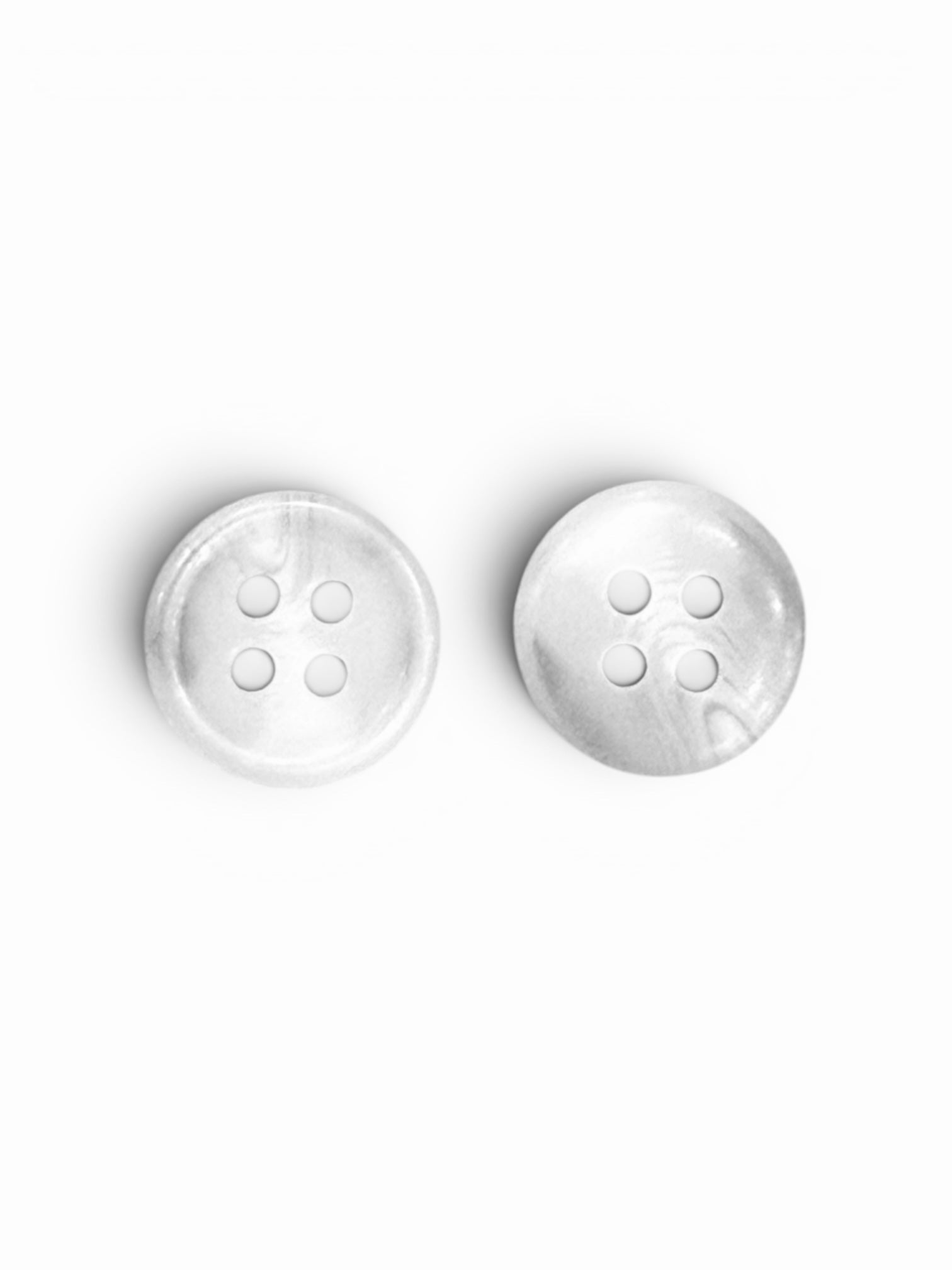 Two 12mm light grey round buttons with a marbled design and four holes on a white background.