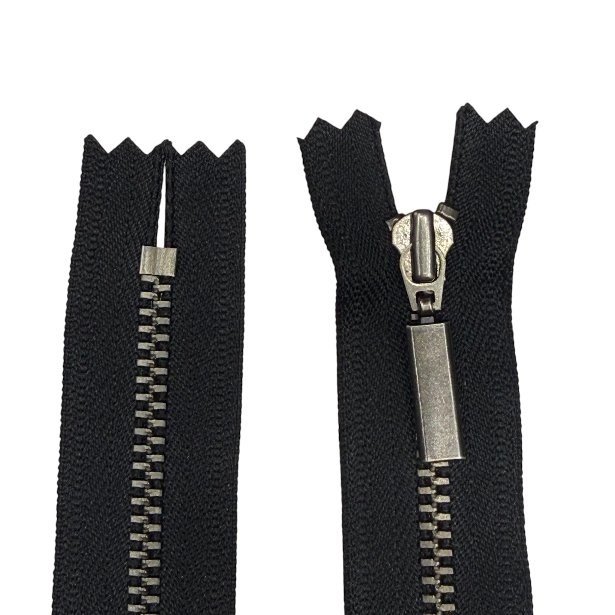 YKK 42cm closed end metal zipper with black tape and gunmetal teeth and slider.