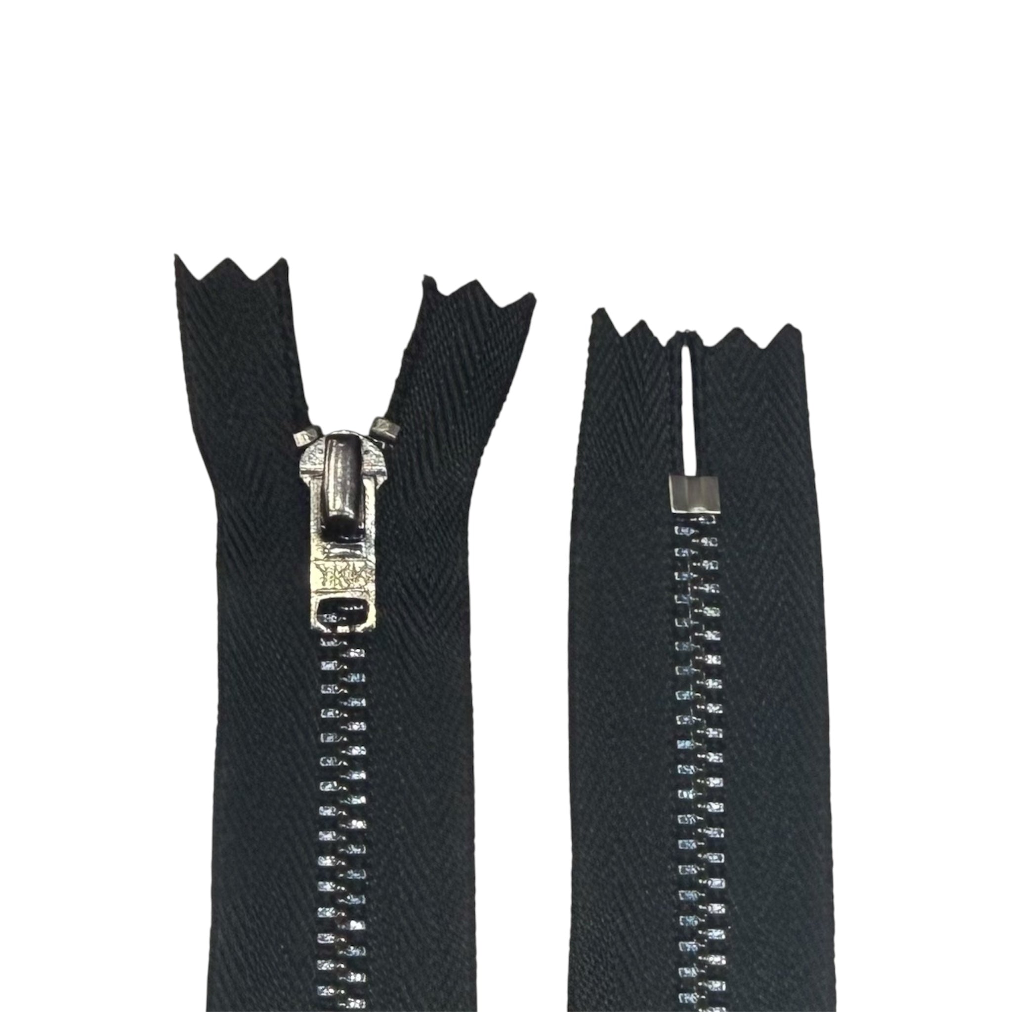 YKK 55cm black metal closed-end zipper with silver teeth and puller on a white background.