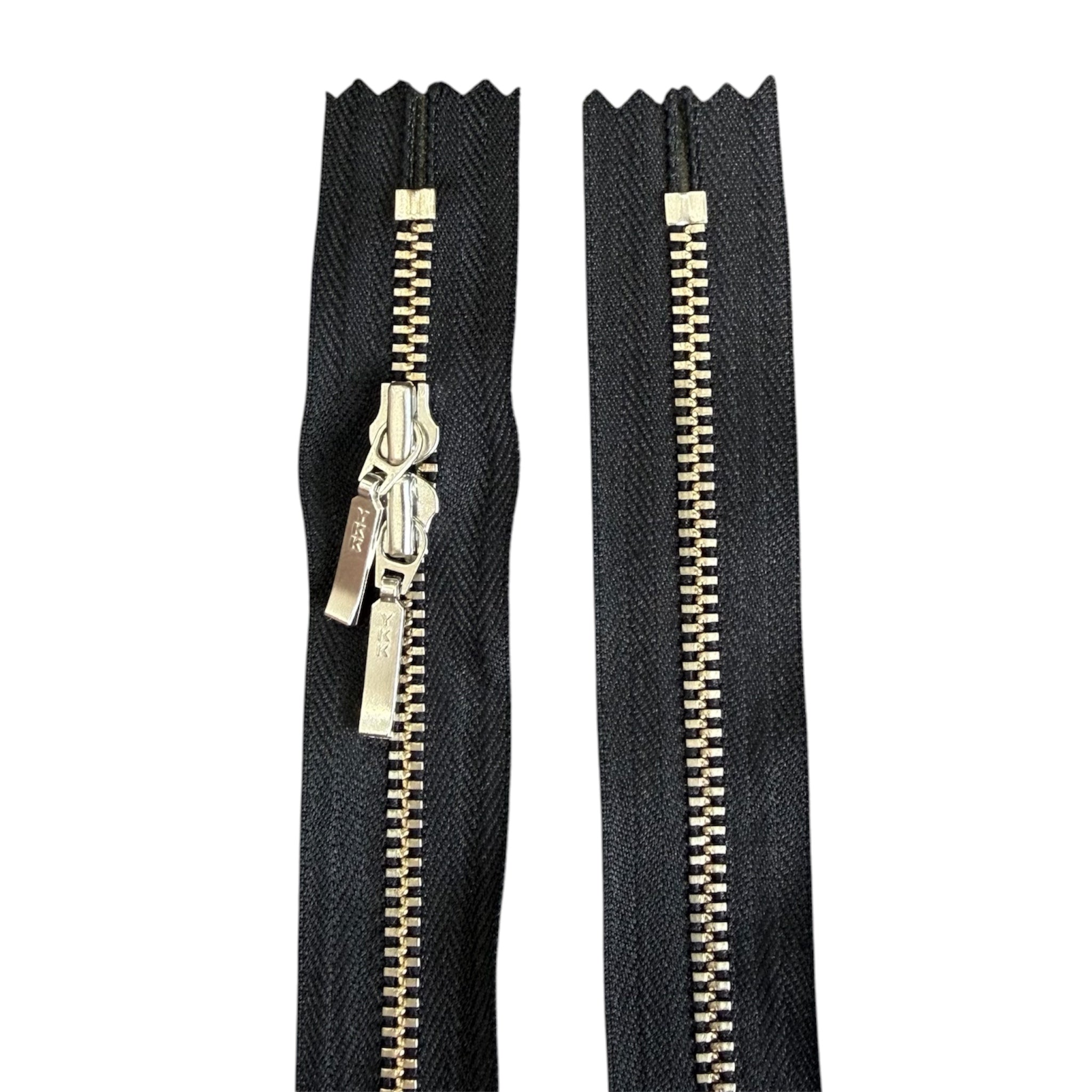 YKK 68cm black tape zipper with silver metal teeth and double sliders on a white background.
