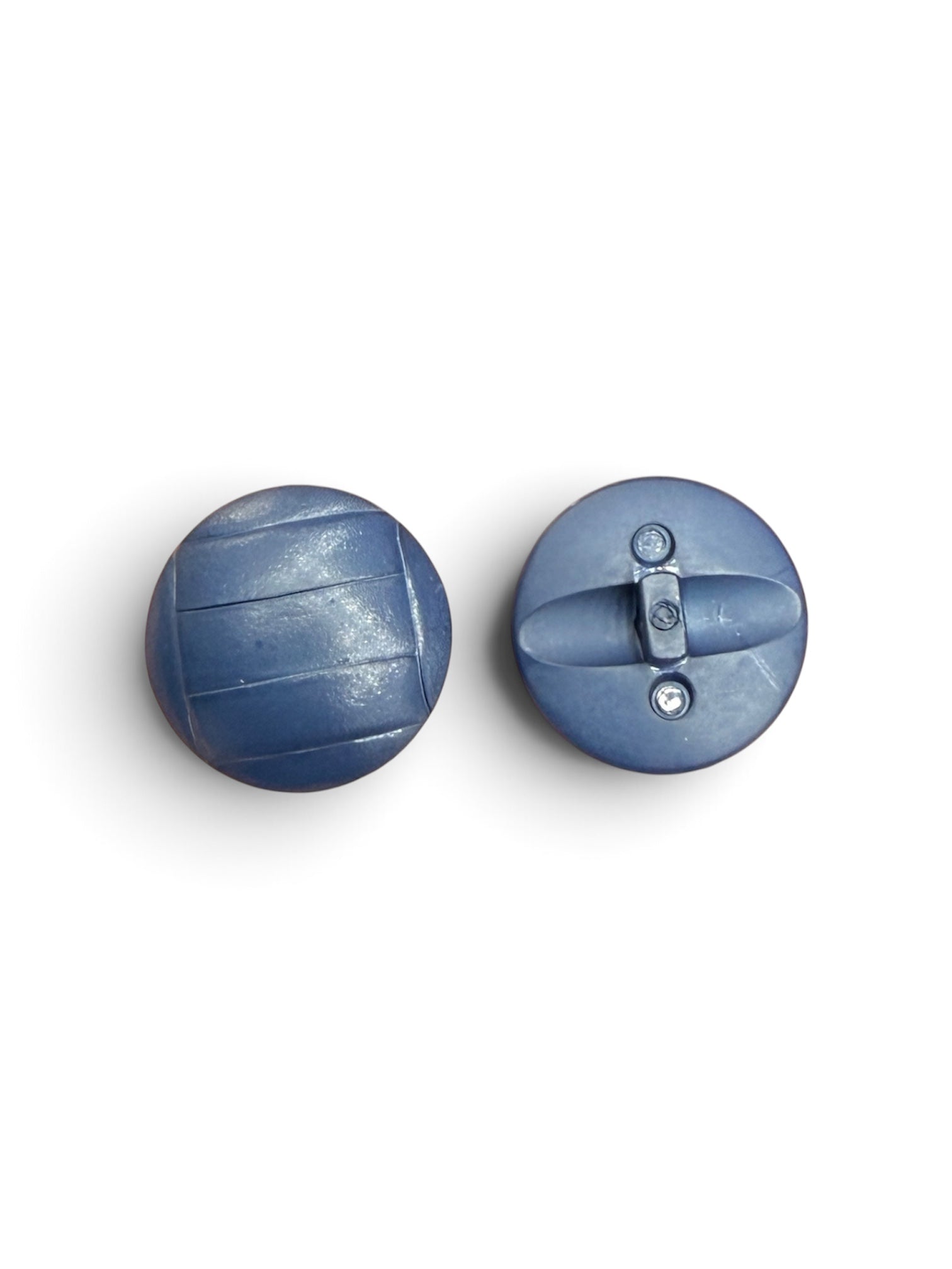 Front and back view of 21mm round navy blue plastic resin sewing buttons with a textured surface.