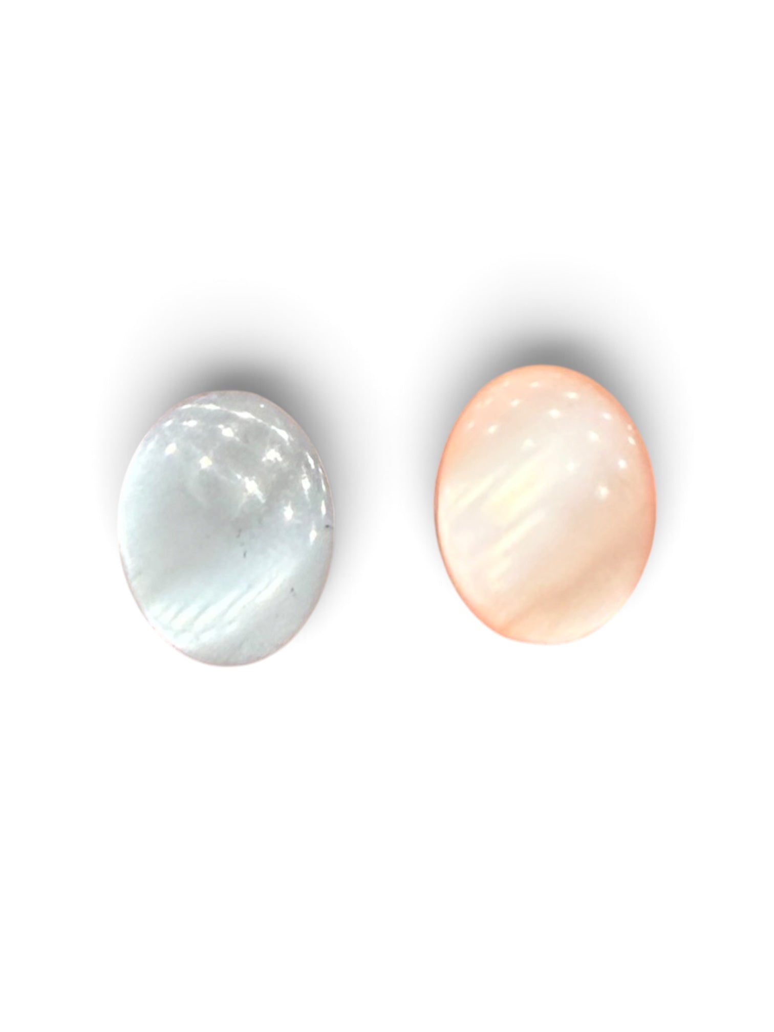 Two 12mm oval polished resin sewing buttons in white and peach with a smooth shiny finish.