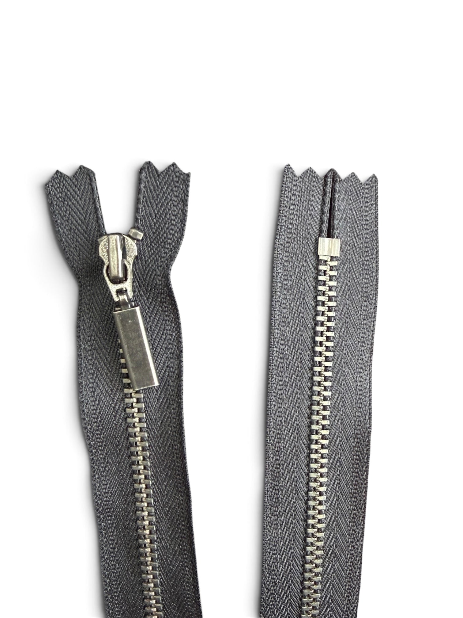 YKK 42cm black closed ended zipper with gun metal teeth and a rectangular pull tab.