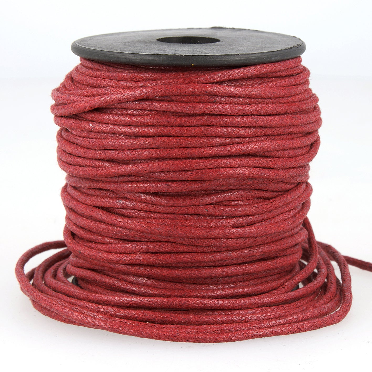 A spool of 2mm red faux leather cord with a textured, braided finish.