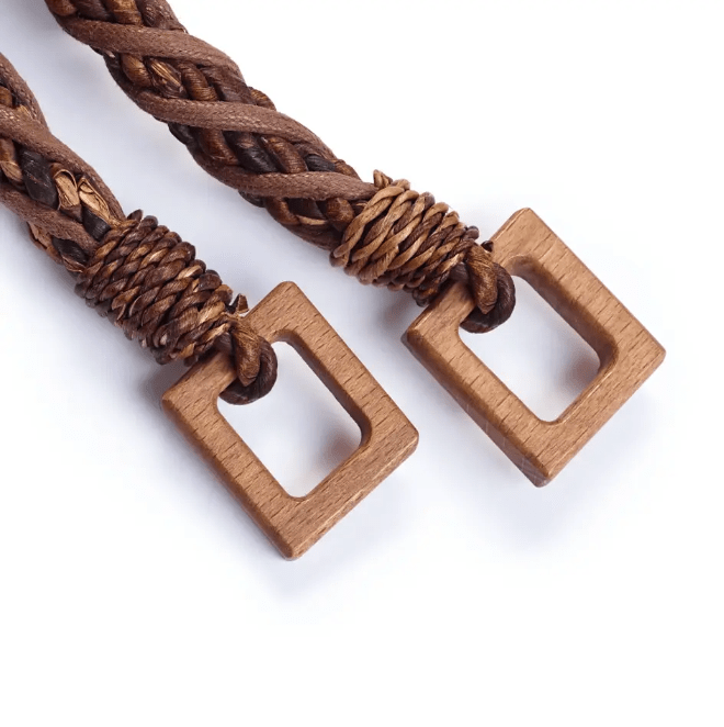 Braided abaca fiber bag handles with wooden rectangular loops.