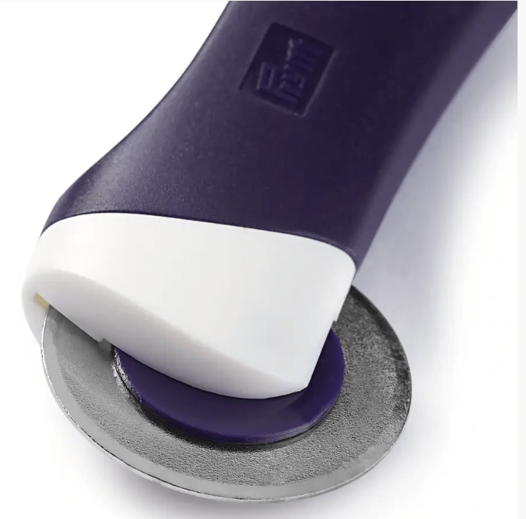 A dark violet and white ergonomic tracing wheel with a smooth steel blade.