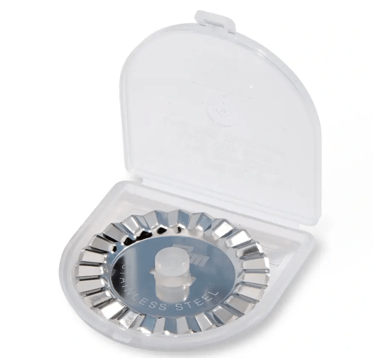 A 45mm serrated rotary cutter blade in a plastic case.