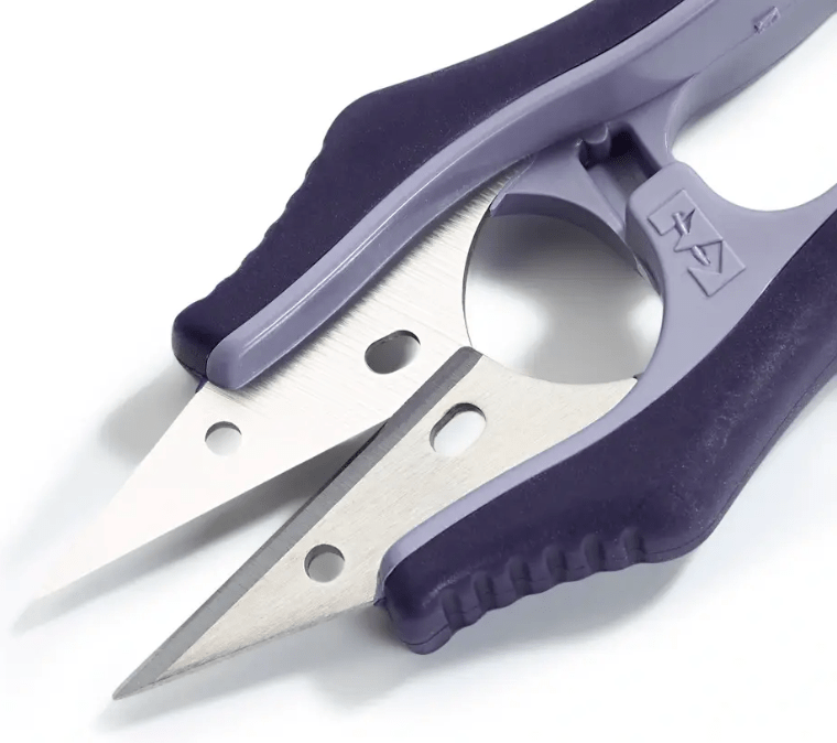 Purple stainless steel thread scissors with an ergonomic handle.